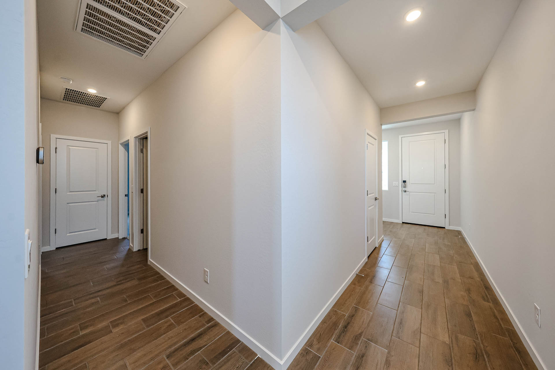 A hallway with white walls.