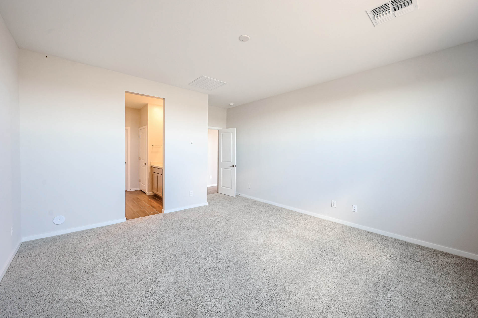 A long hallway with white walls.