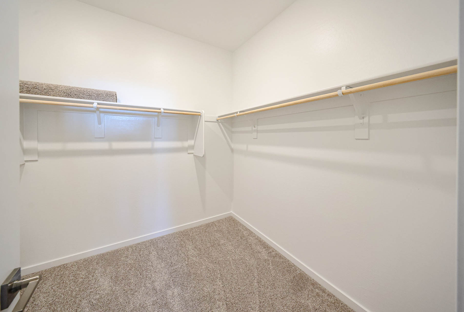 A white wall with a vent.