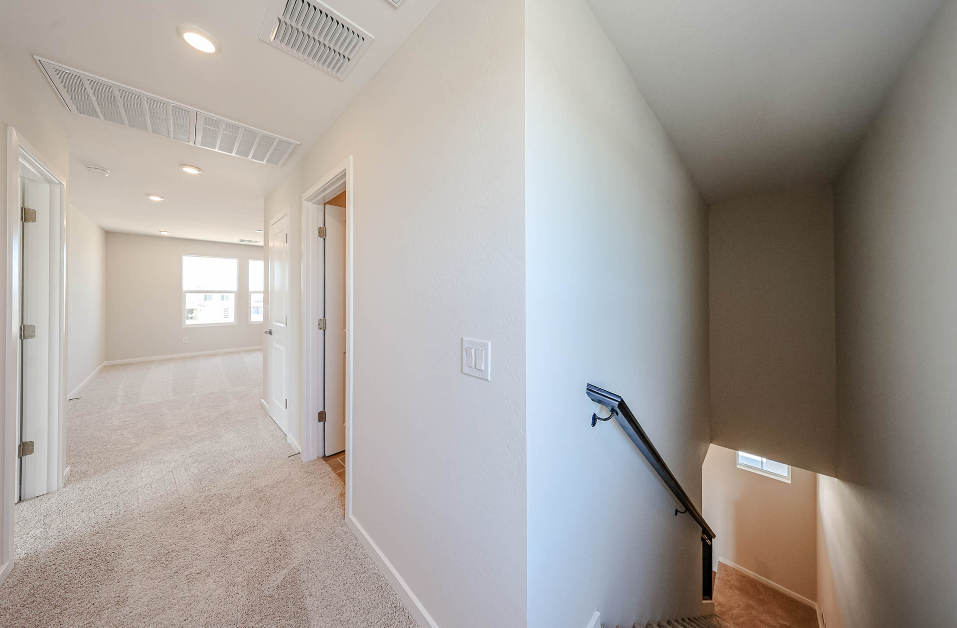 A hallway with white walls.