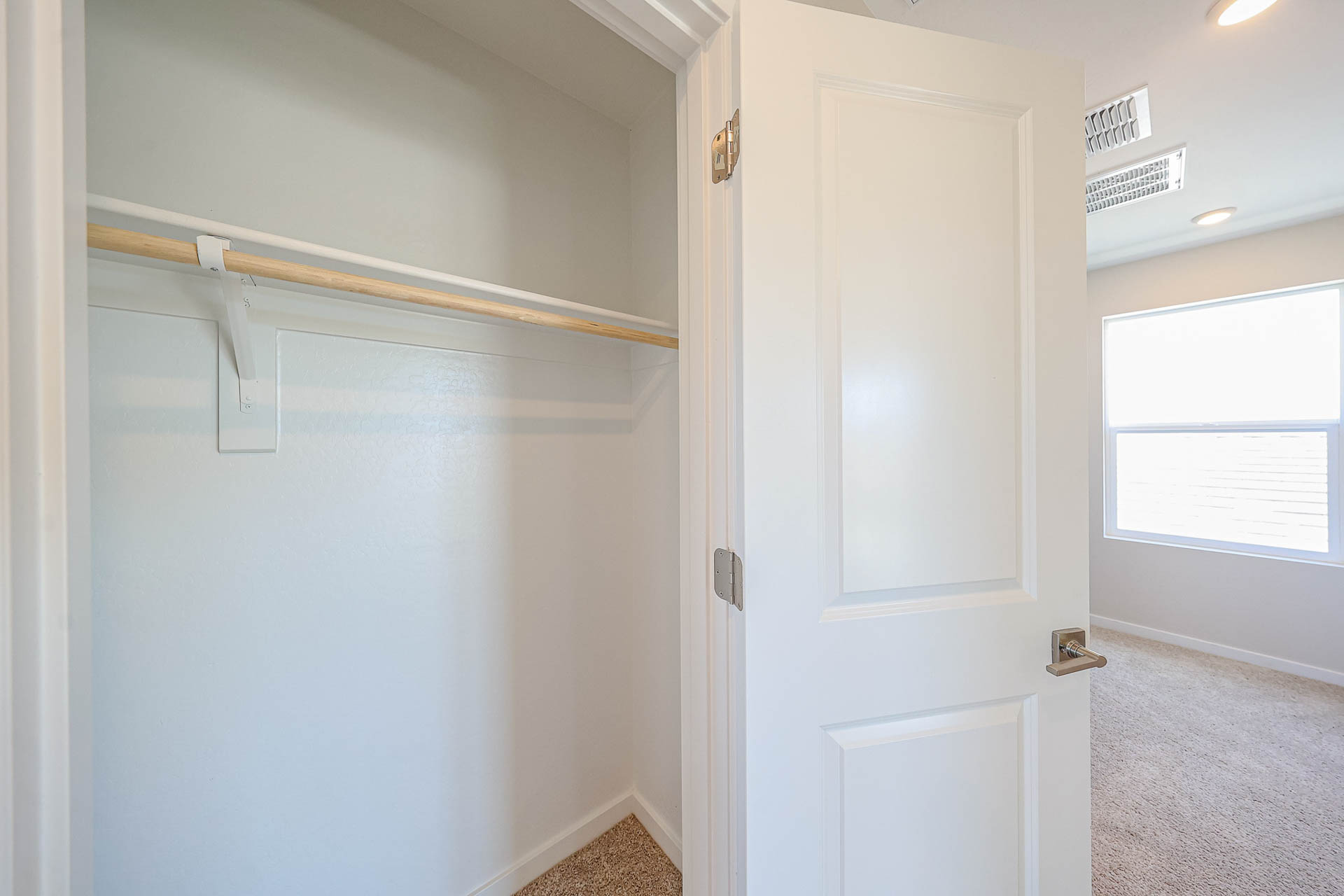 A white door with a window.