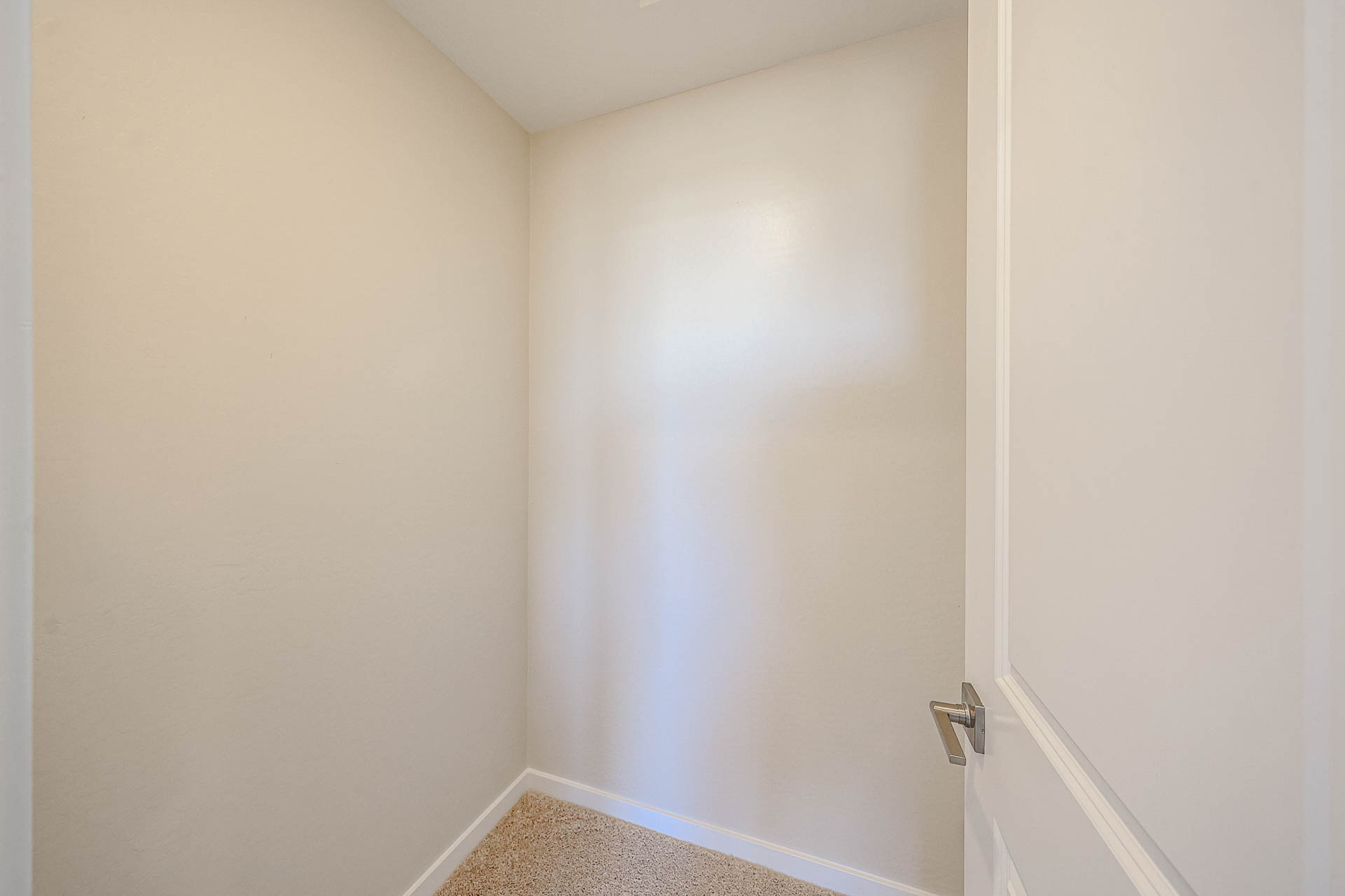 A white door with a glass window.