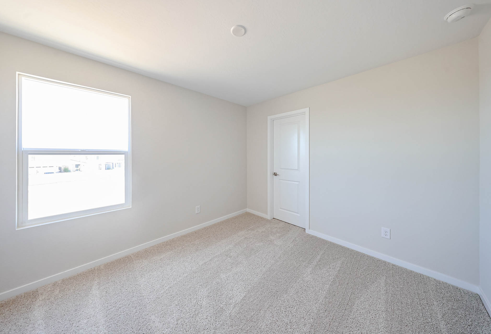 A room with a door and a window.