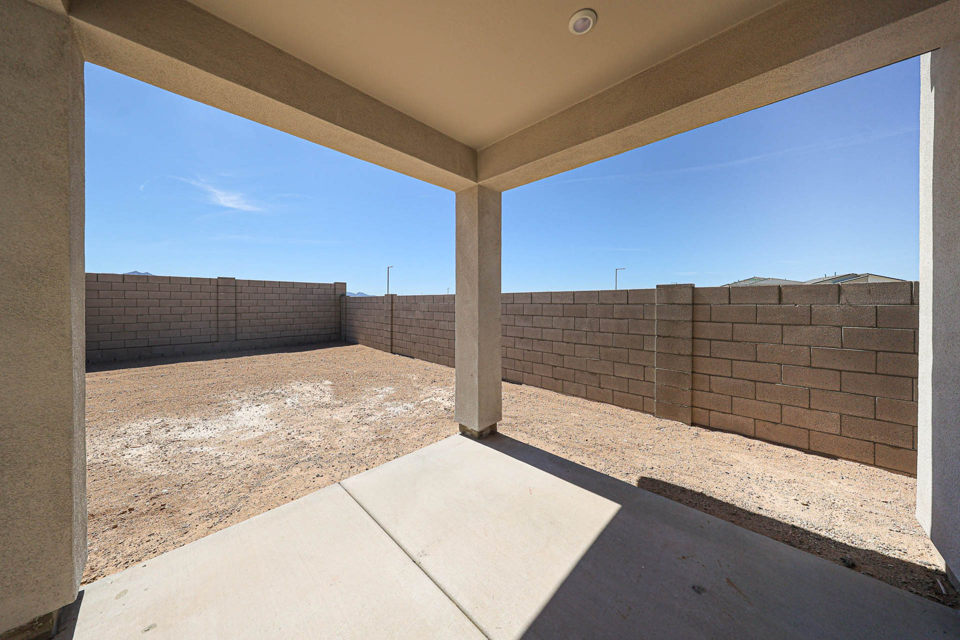 A brick wall with a walkway.