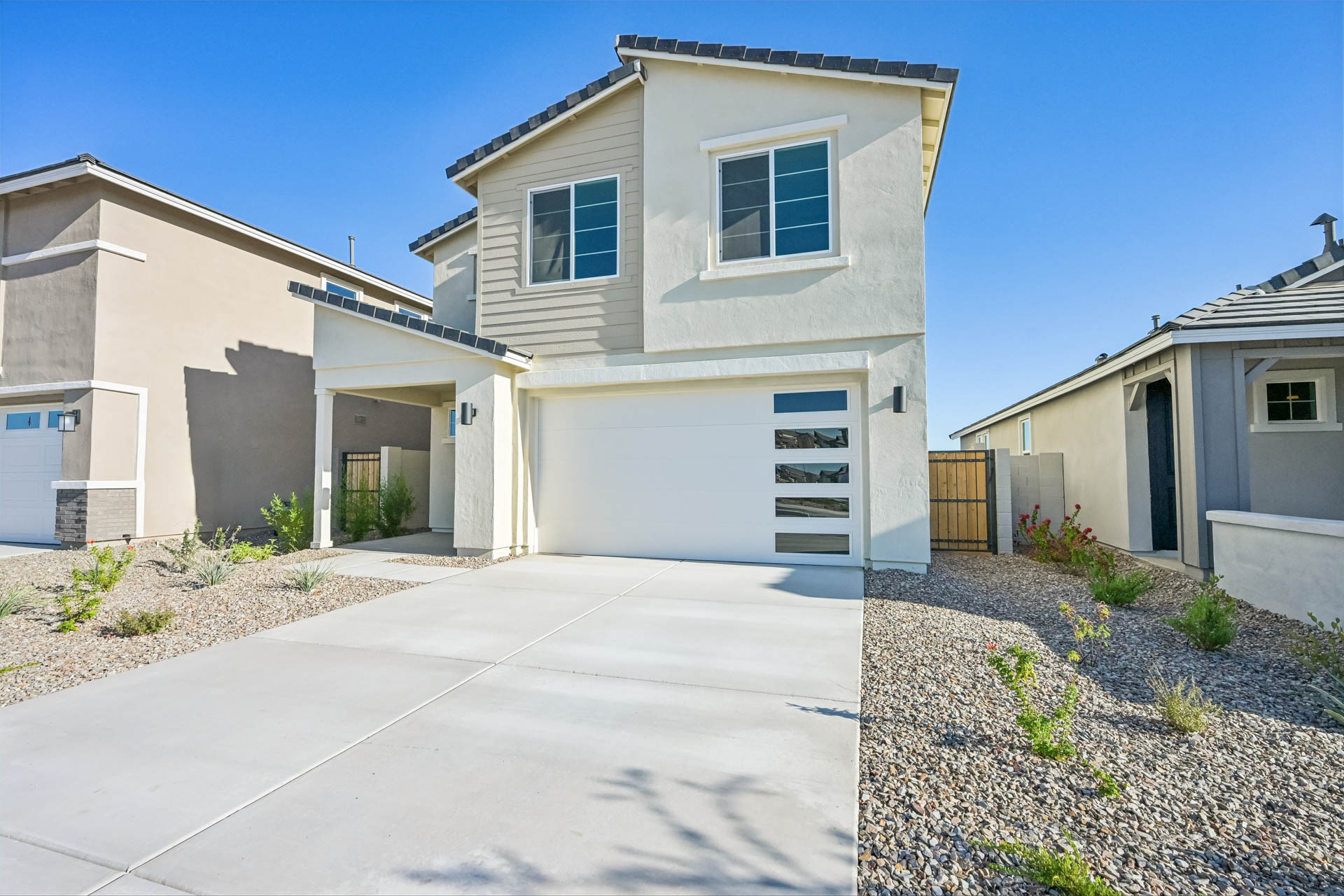 A driveway leading to a house.