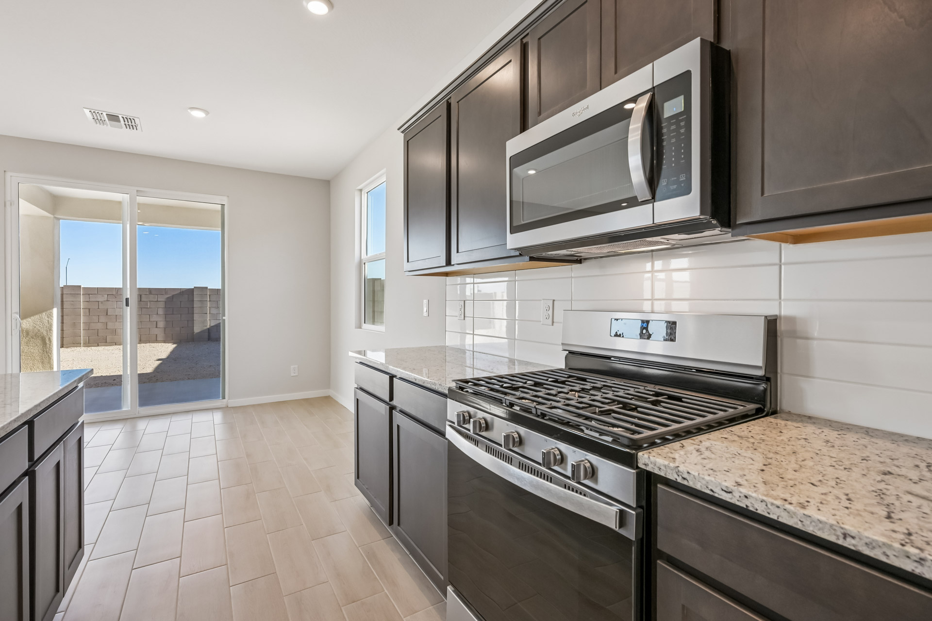 A kitchen with black appliances.