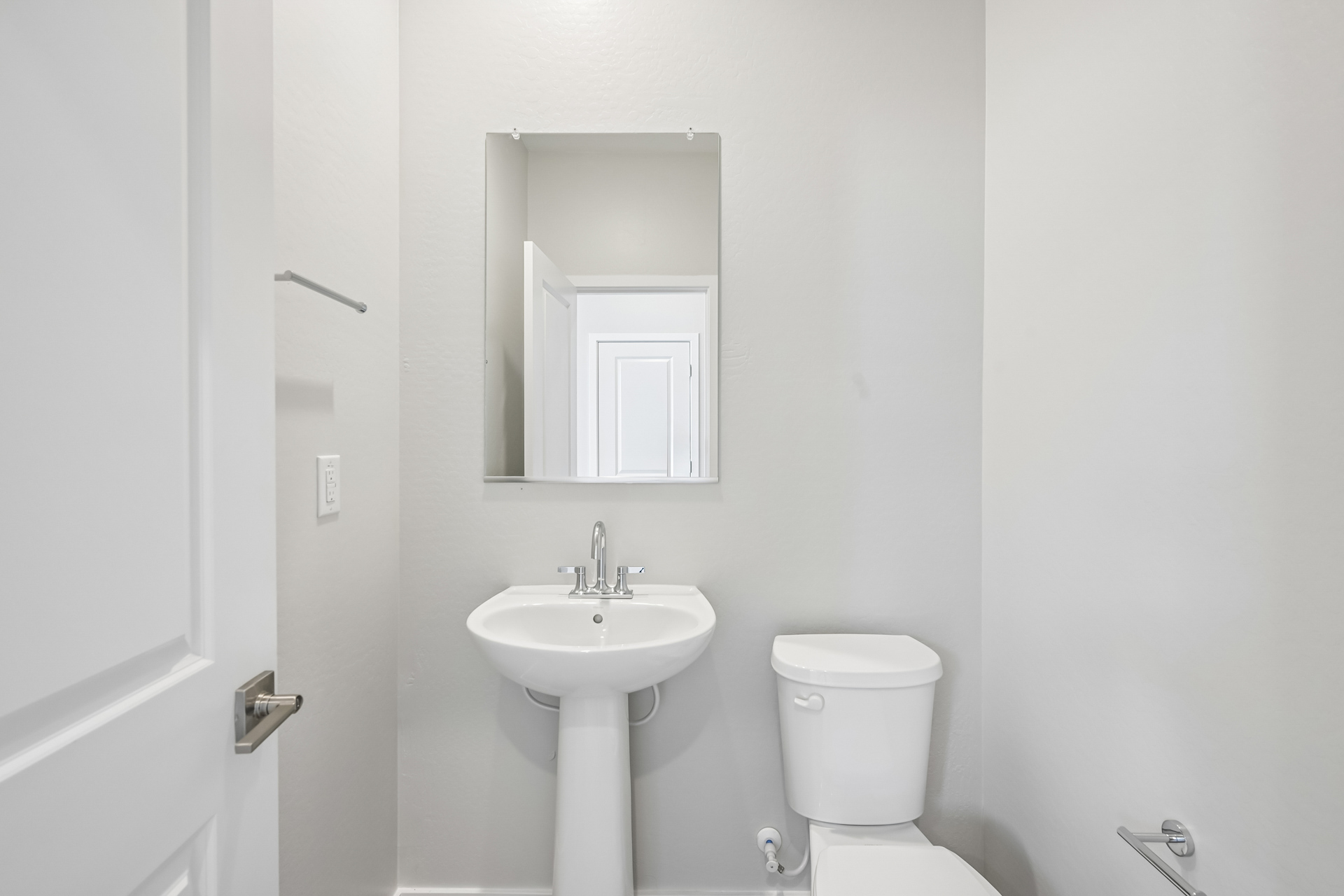 A bathroom with a sink and toilet.