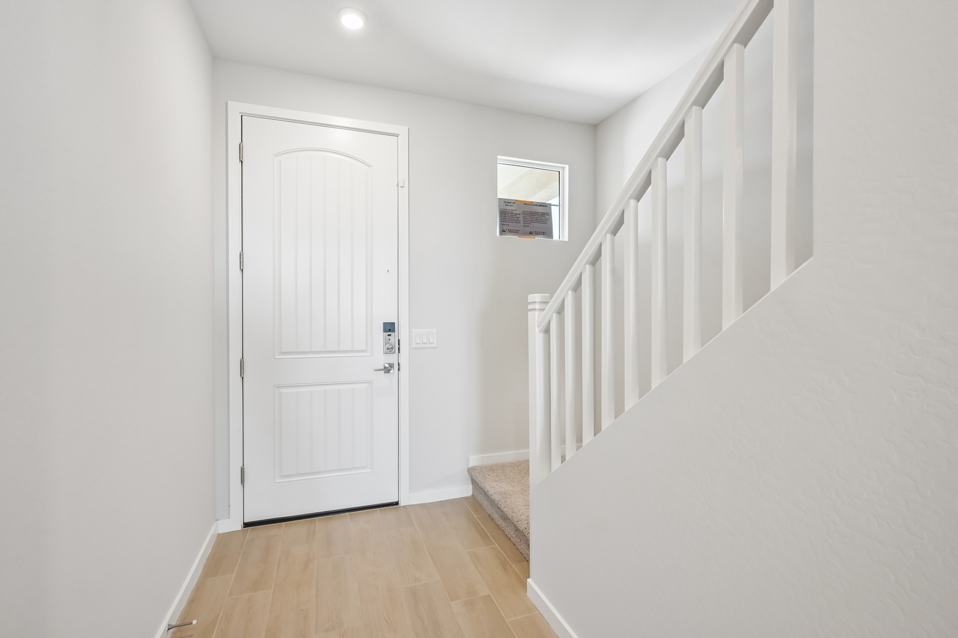 A white door in a hallway.