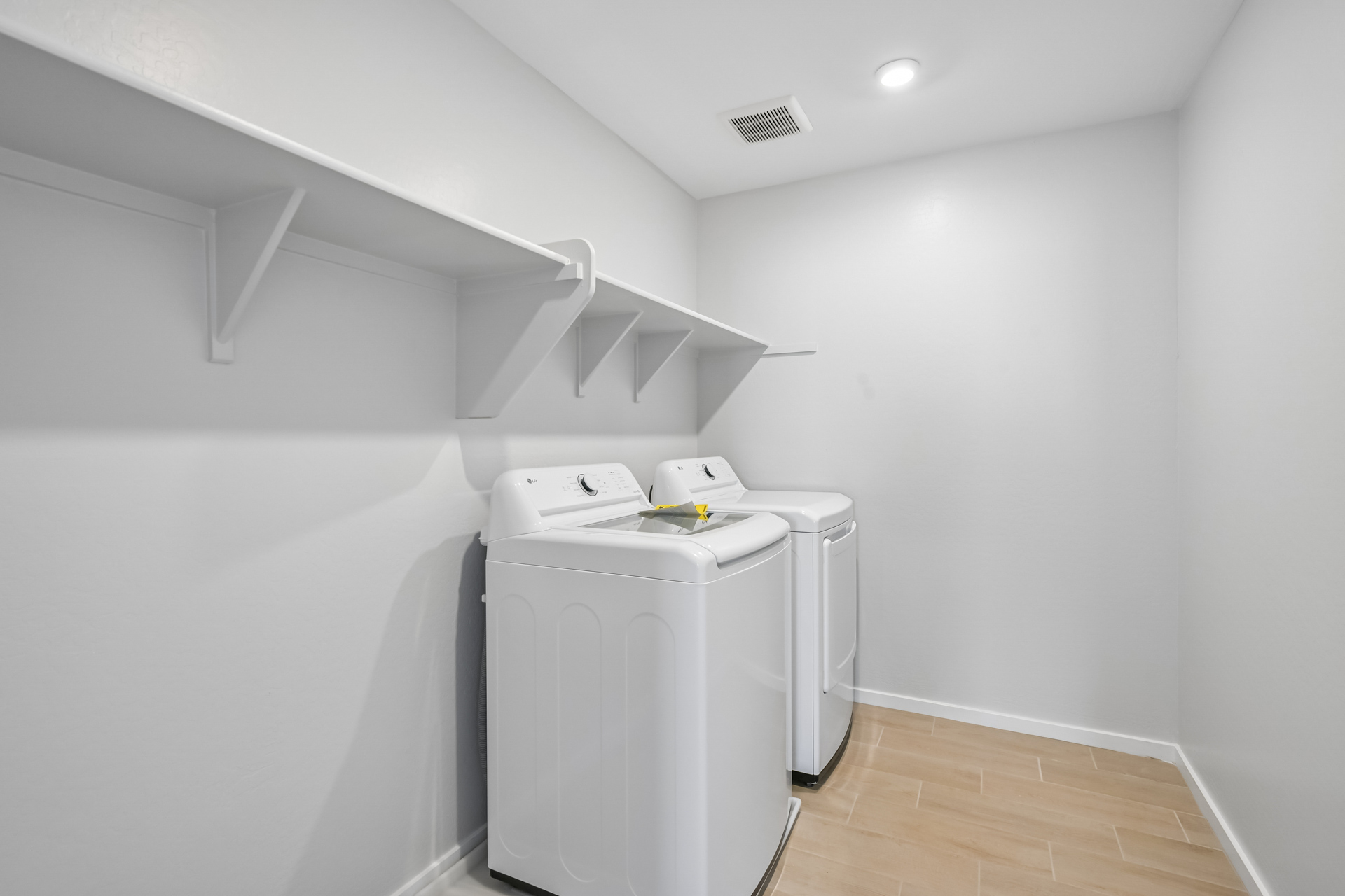 A white room with a white wall and a white machine.
