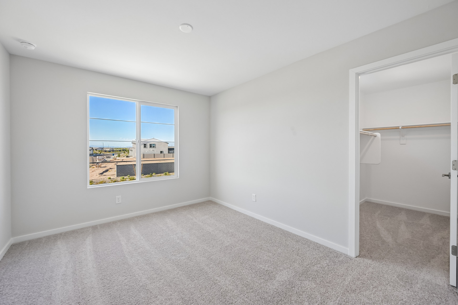 A room with a window and a door.