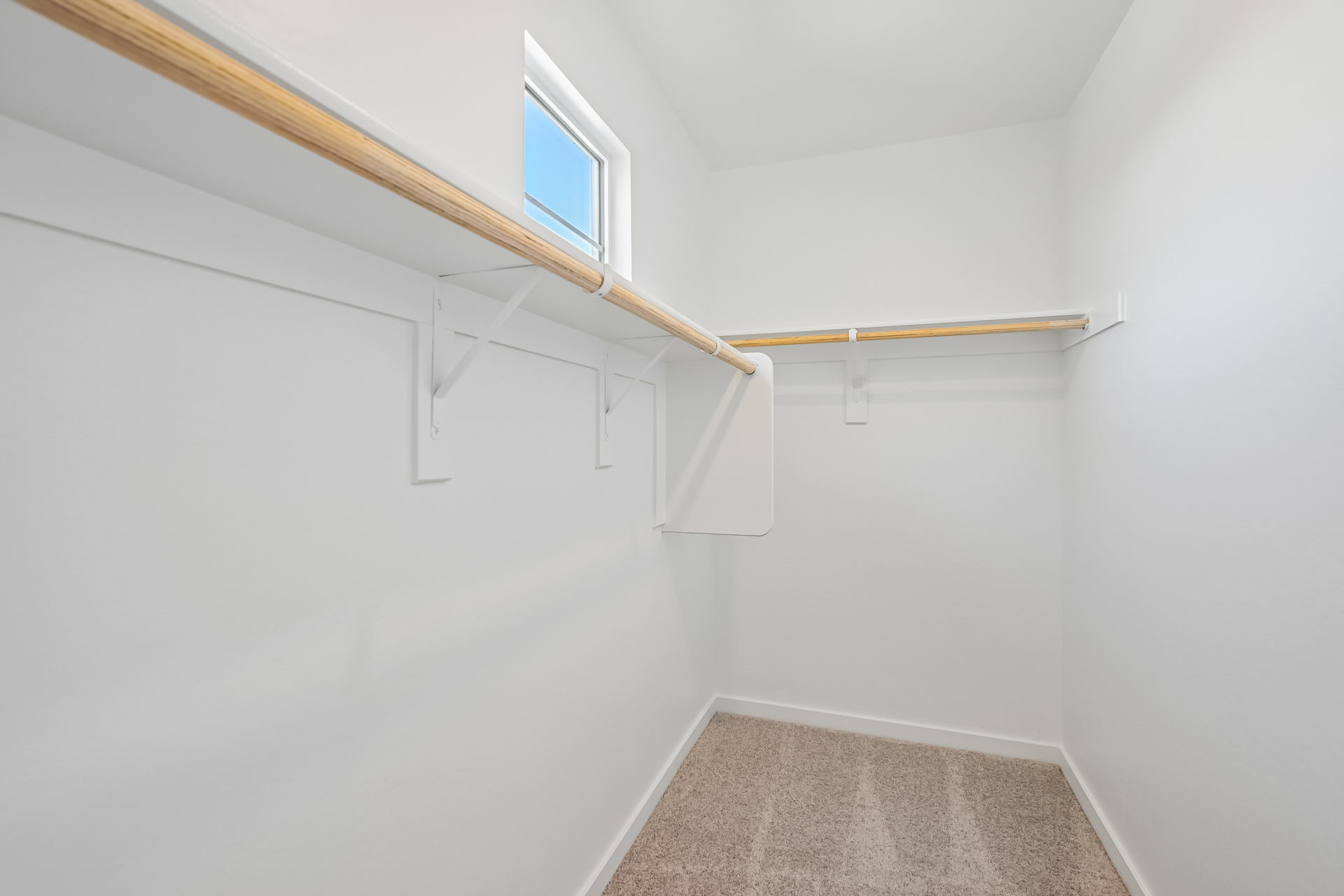 A white room with a window.