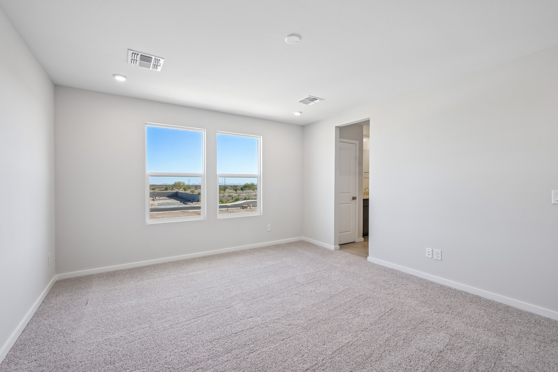 A room with a window and a door.