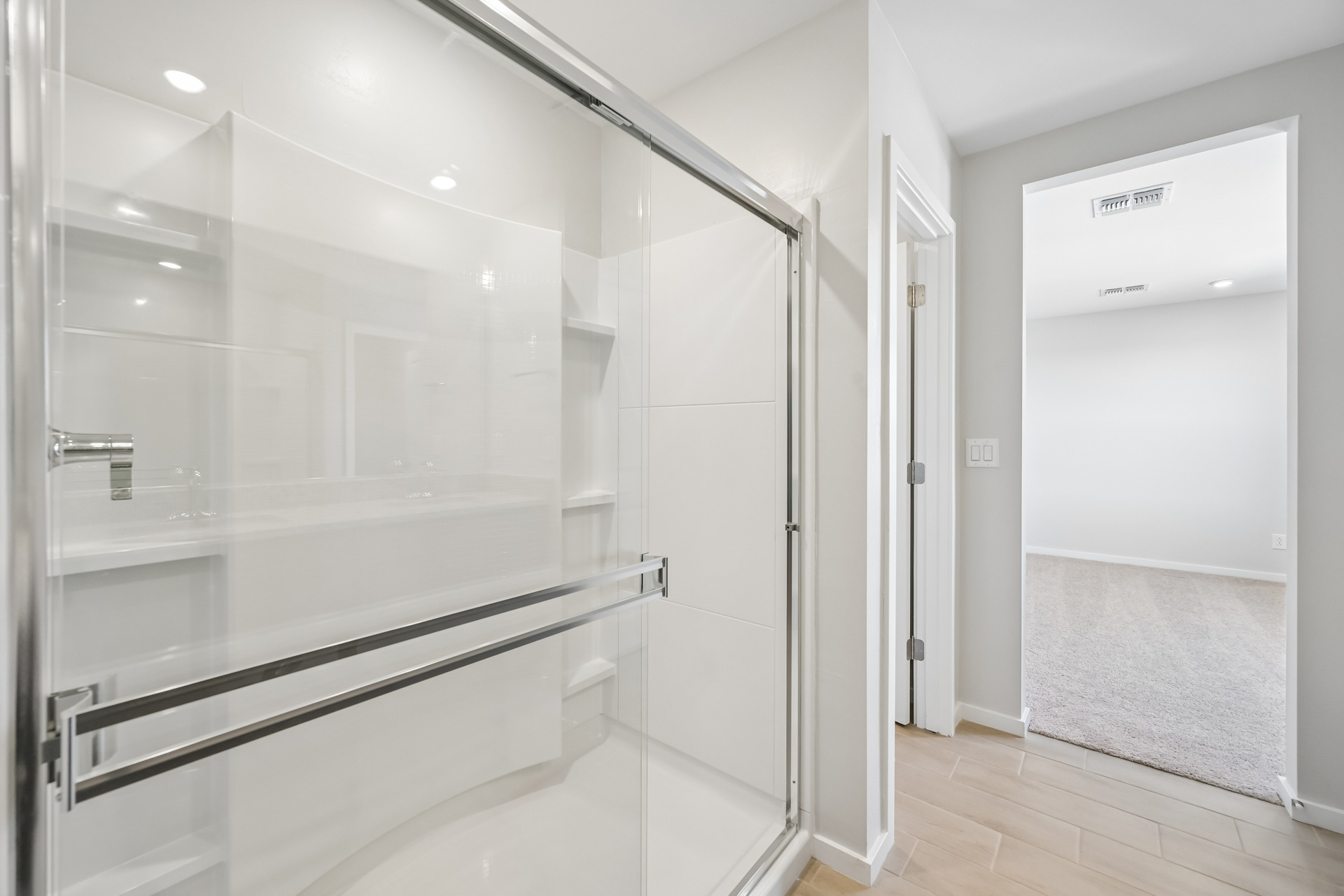 A bathroom with a glass shower.