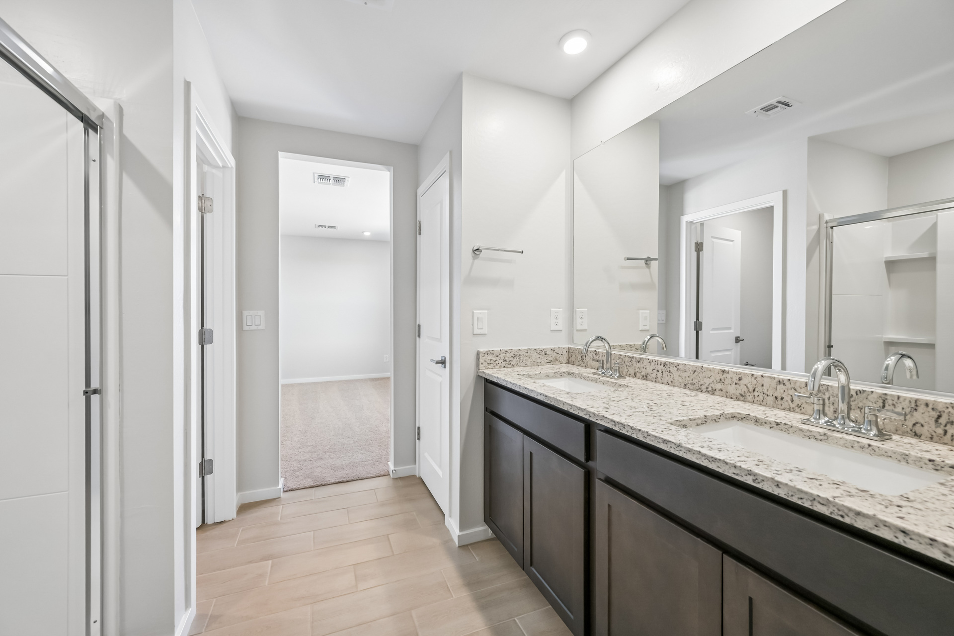 A bathroom with a marble countertop.