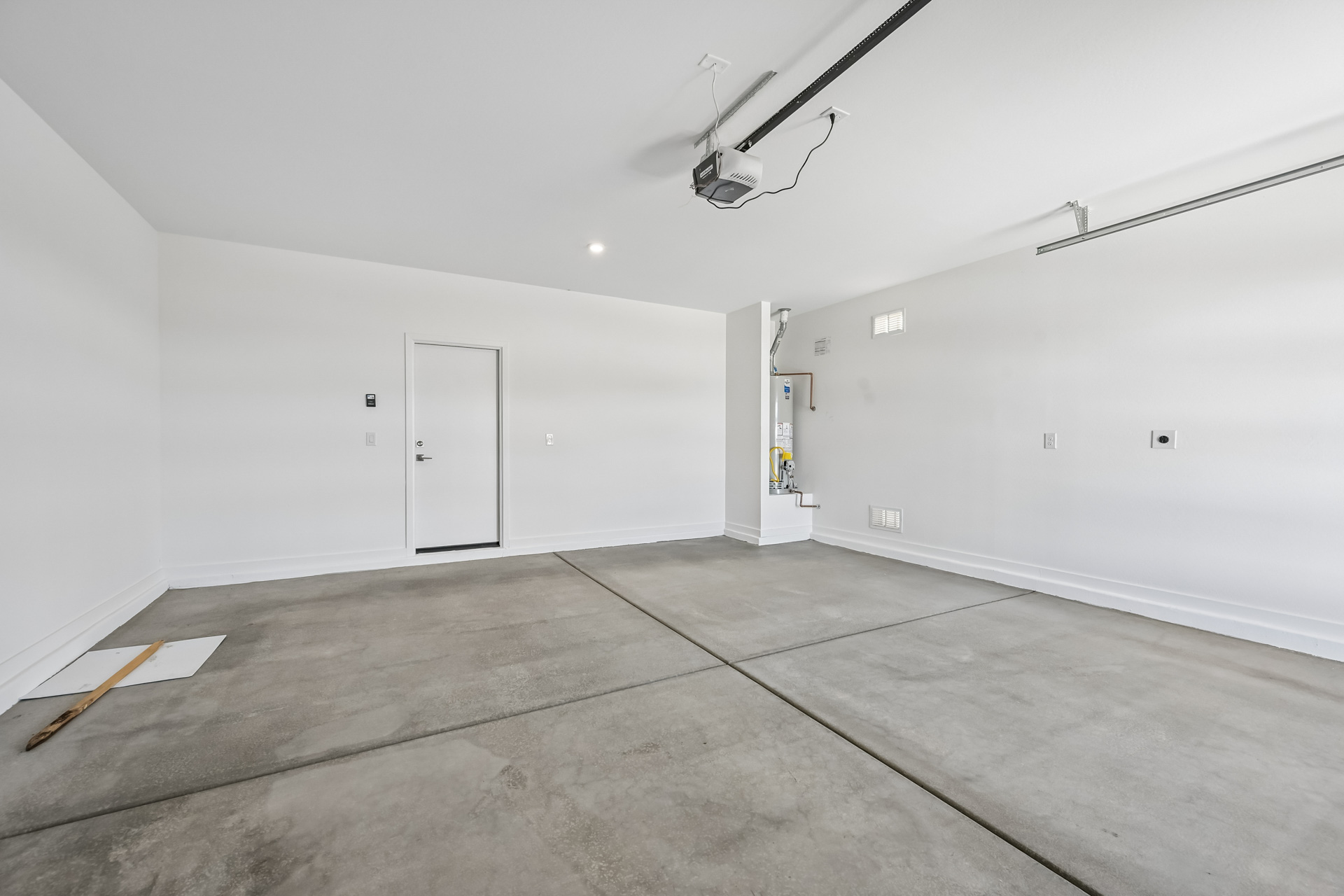 A room with white walls and a wood floor.