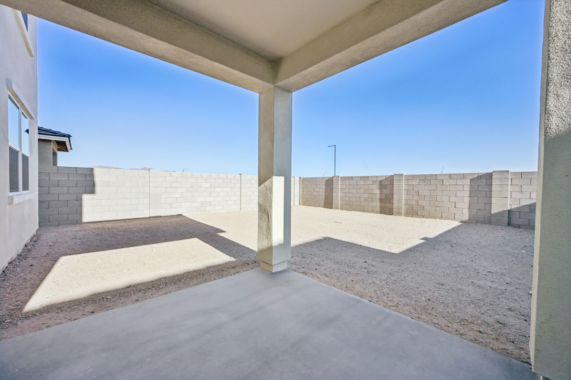 A building with a stone patio.