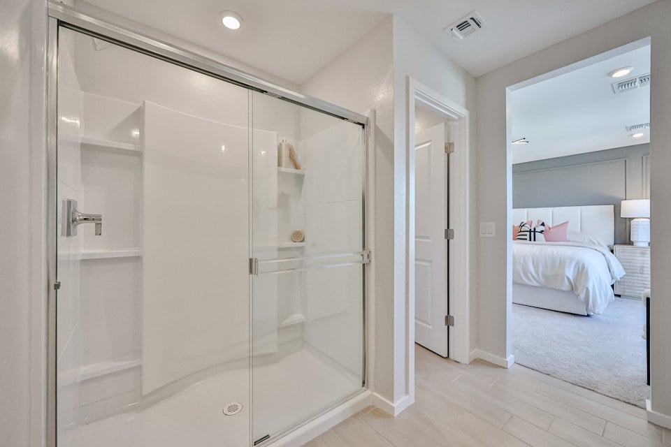 A bathroom with a glass shower.