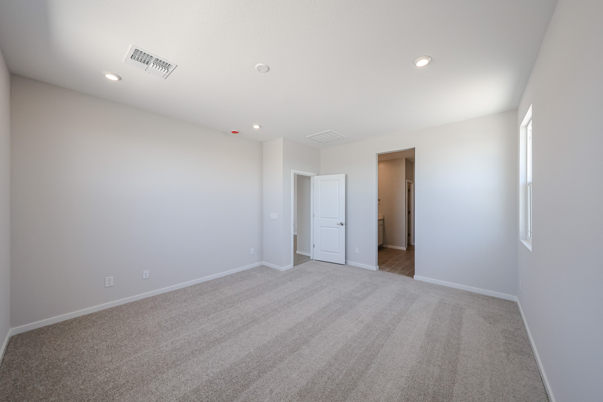 A hallway with white walls.