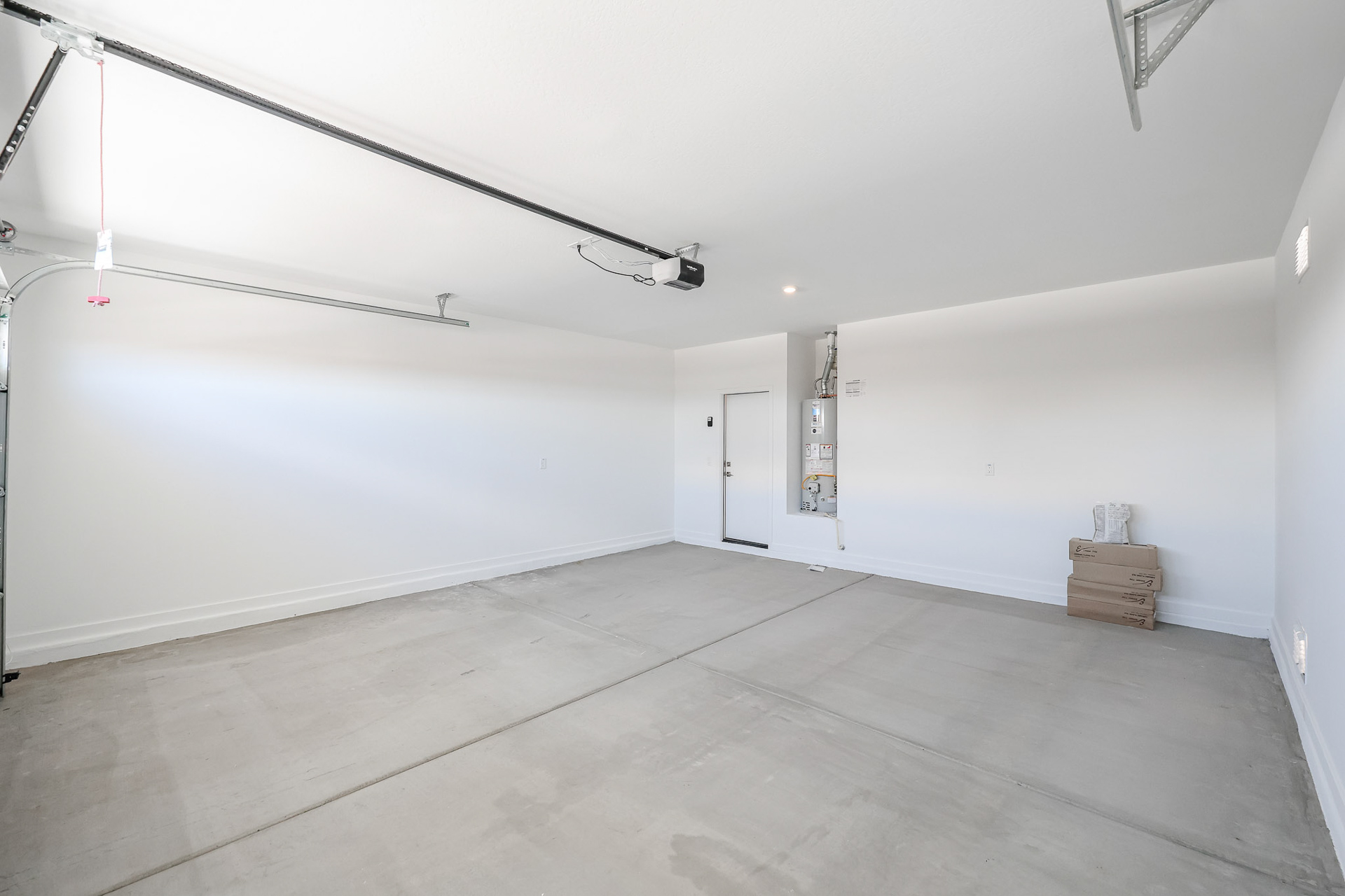 A room with a white wall and a white door.