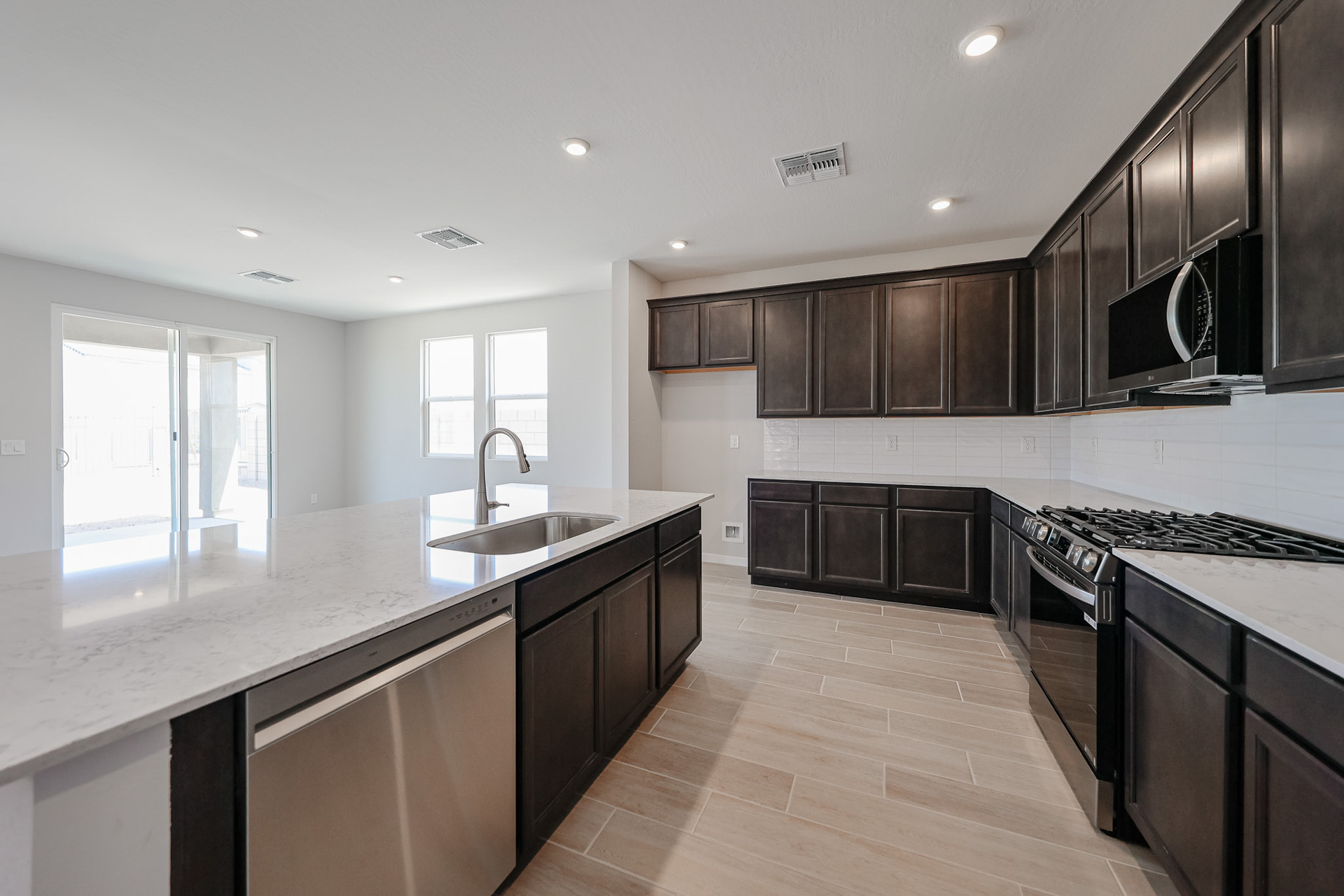 A kitchen with black appliances.