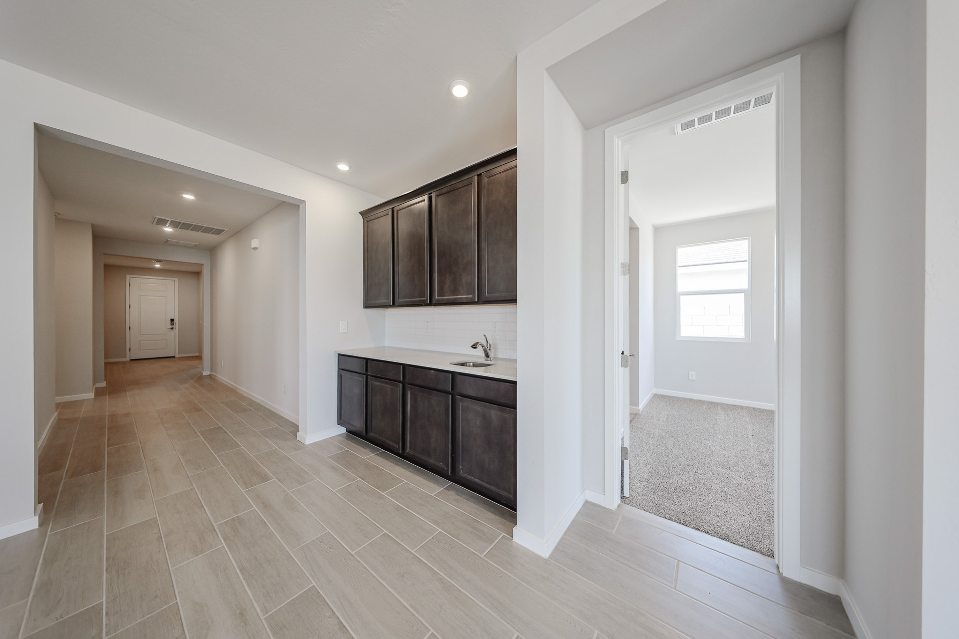A bathroom with a wood floor.