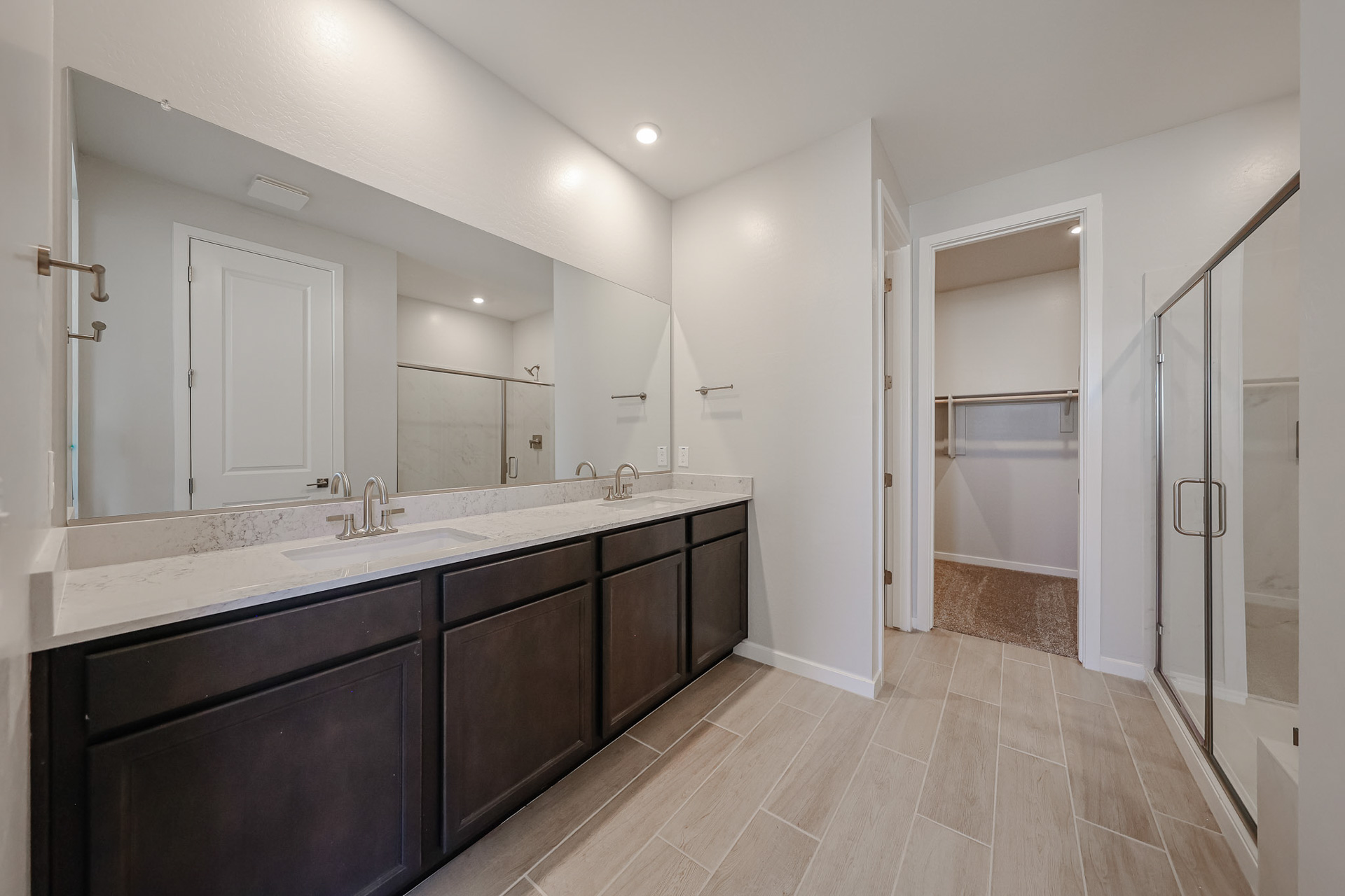 A bathroom with a large mirror.