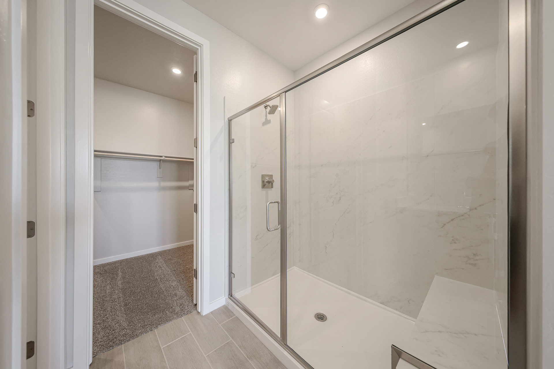 A bathroom with a glass shower.