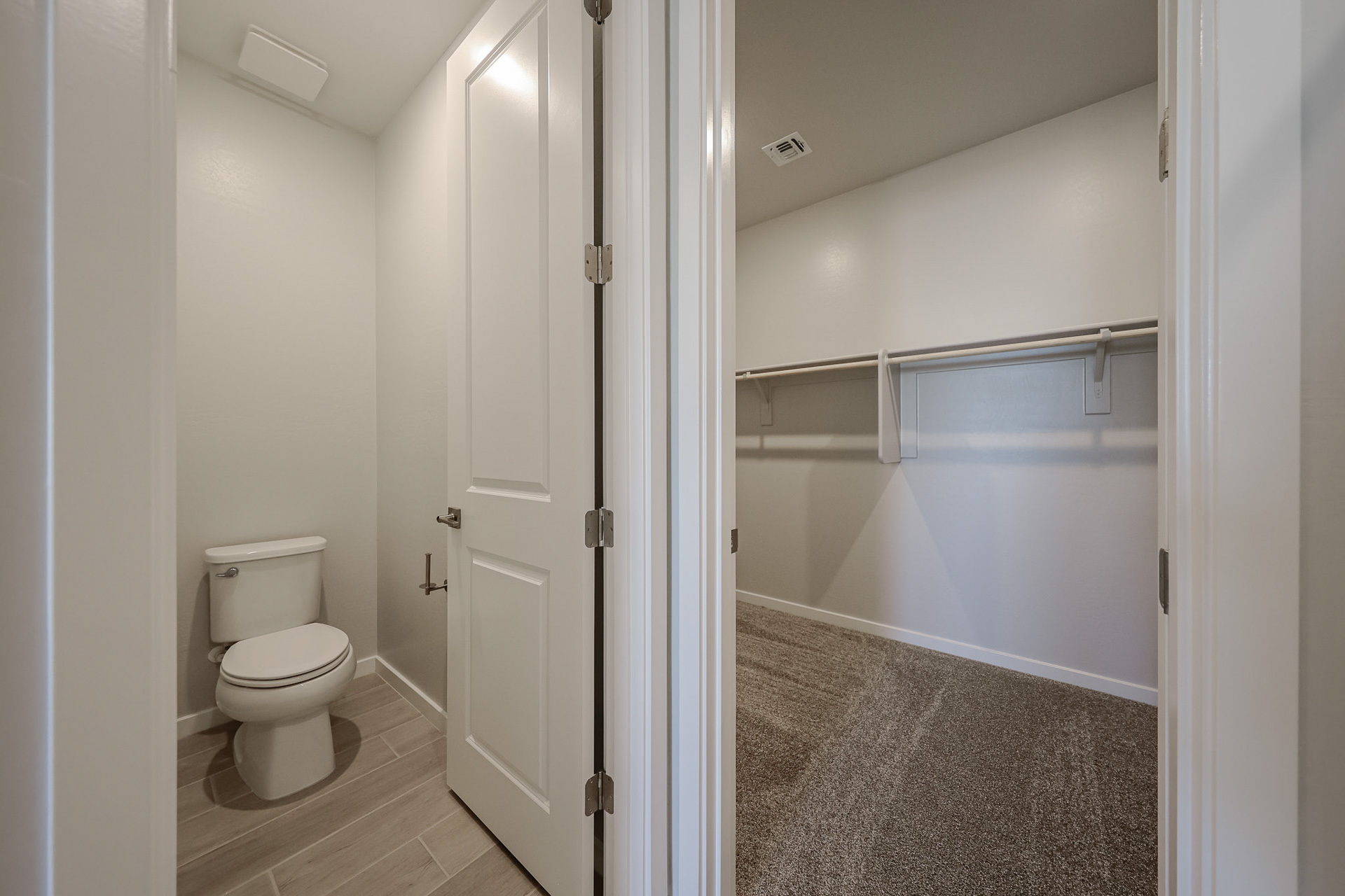 A bathroom with a shower and toilet.