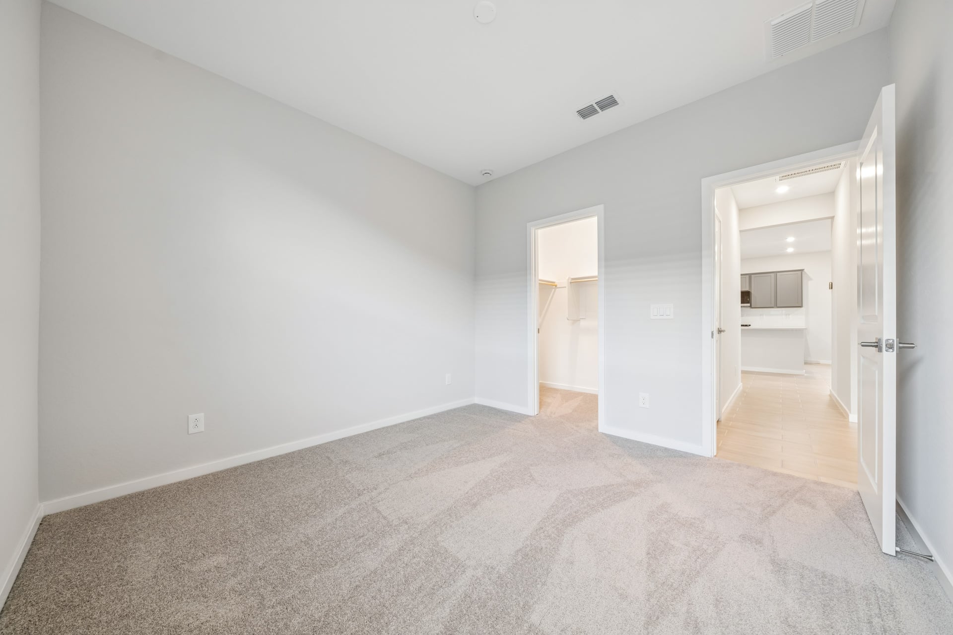 A hallway with white walls.