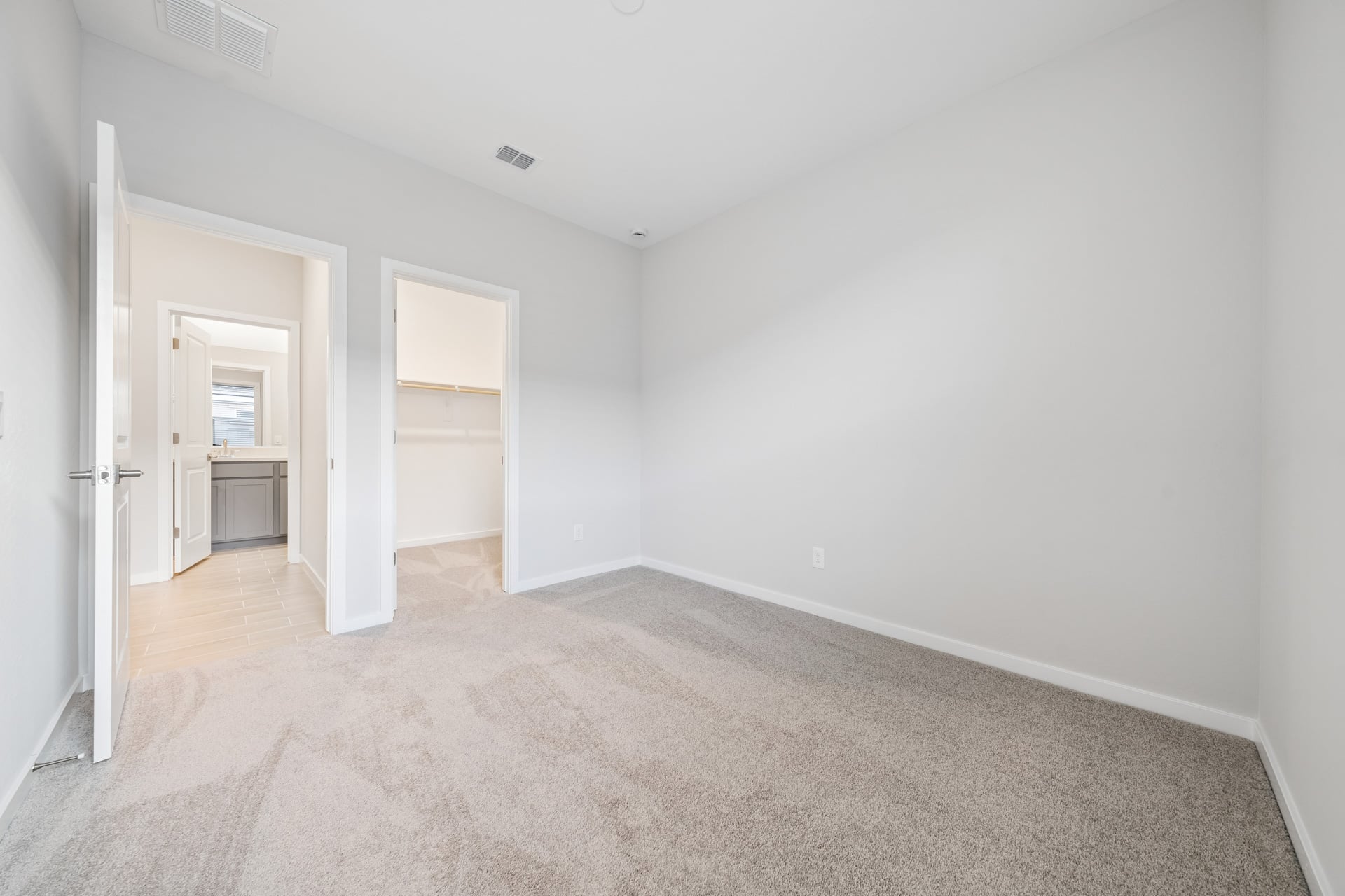 A hallway with white walls.