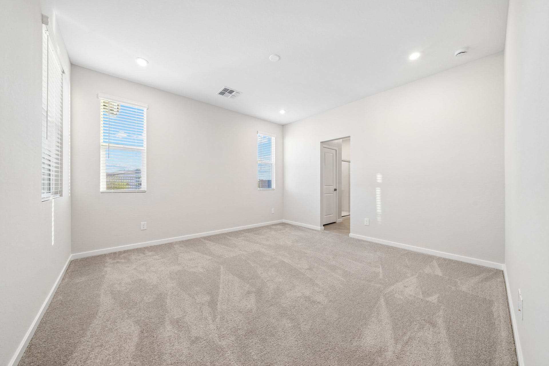 A hallway with a carpet.