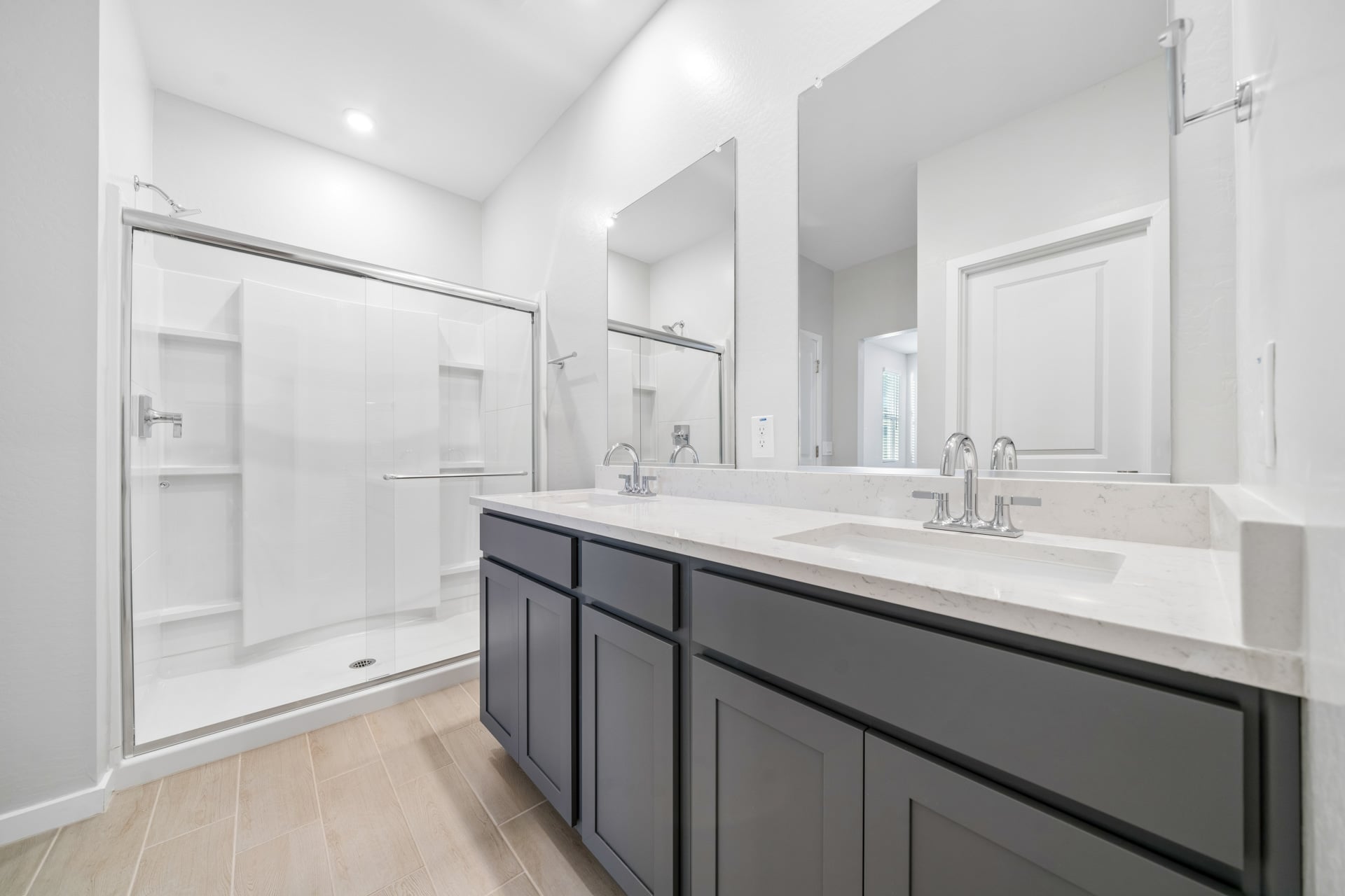 A bathroom with a glass shower.