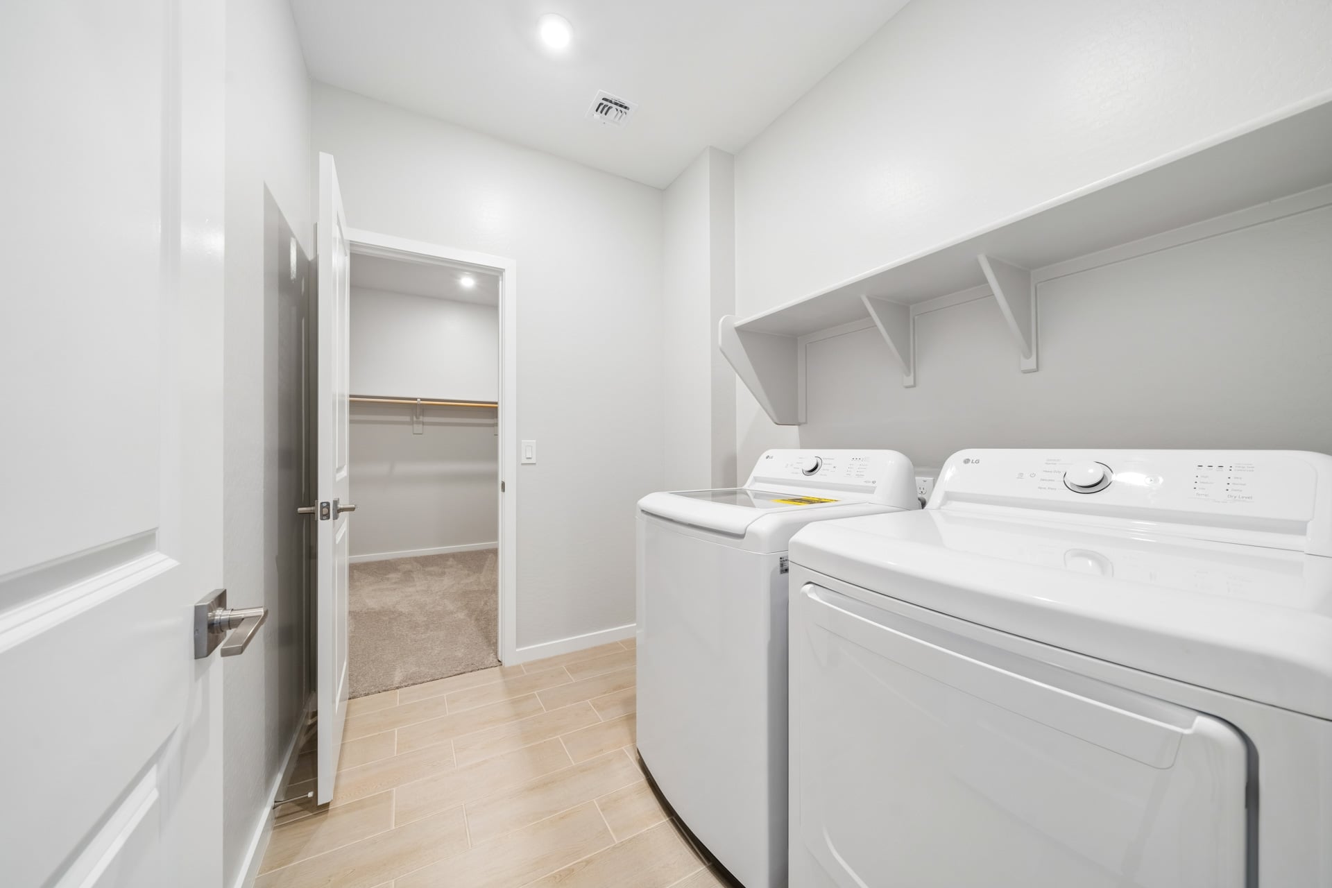 A room with white cabinets and a white counter top.
