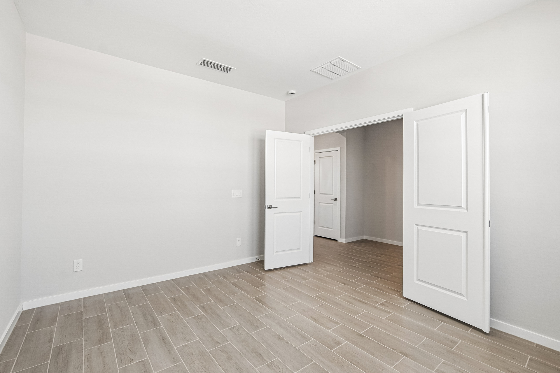 A room with white doors.