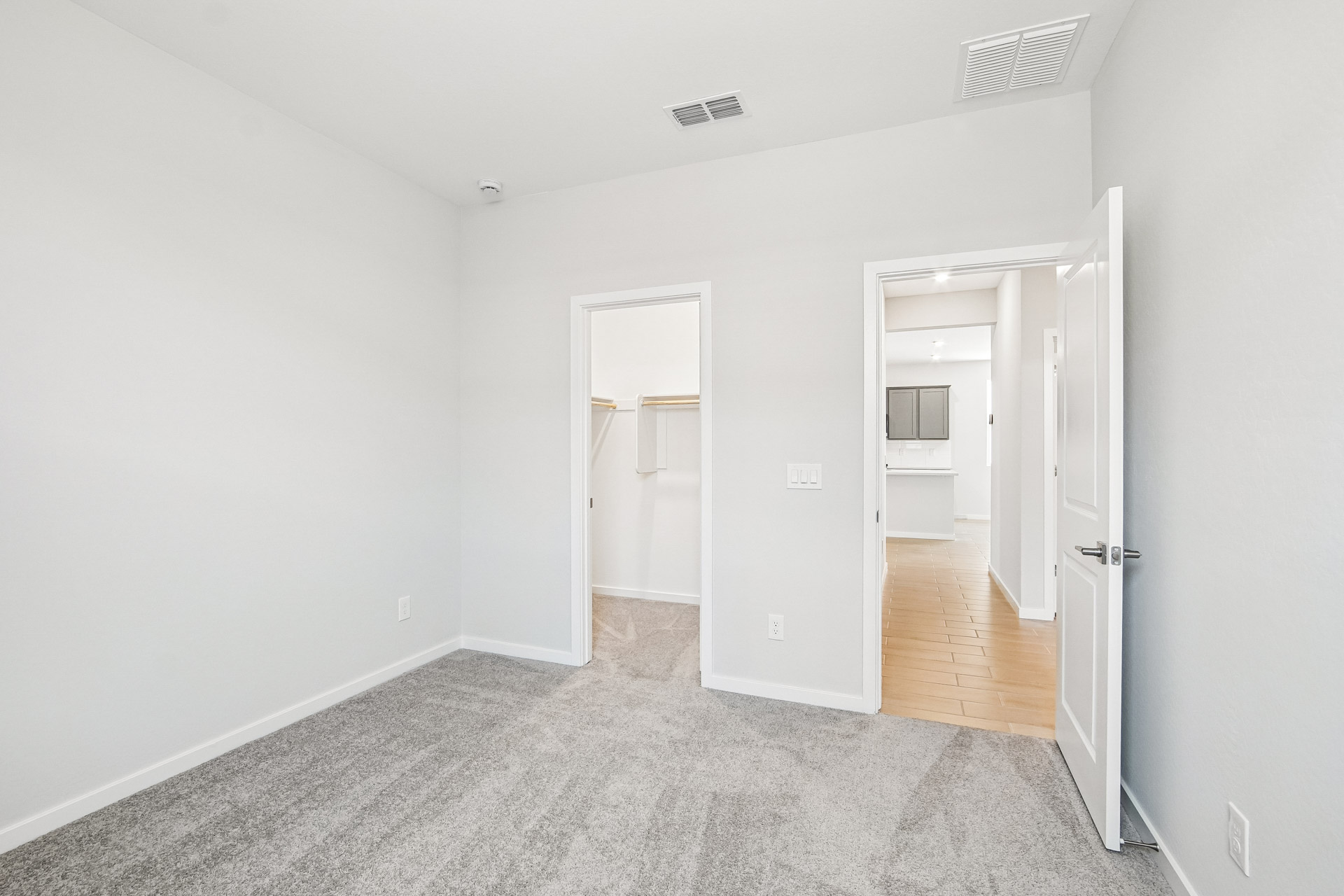 A hallway with white walls.