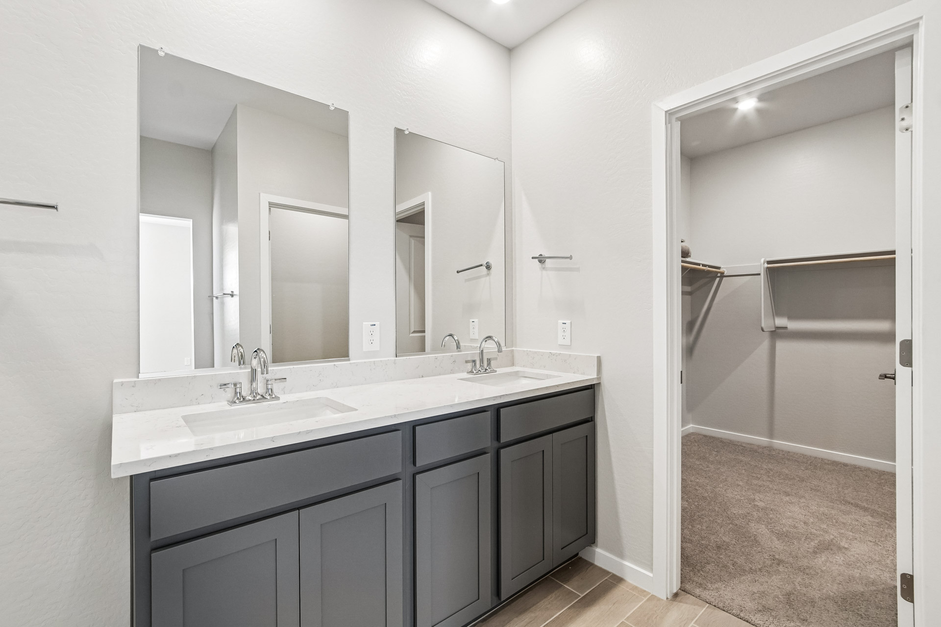 A bathroom with a sink and a shower.