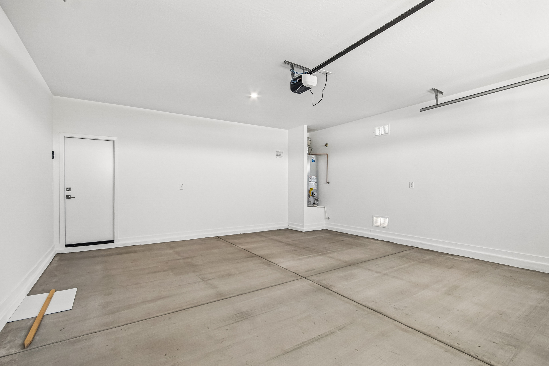 A room with white walls and a wood floor.