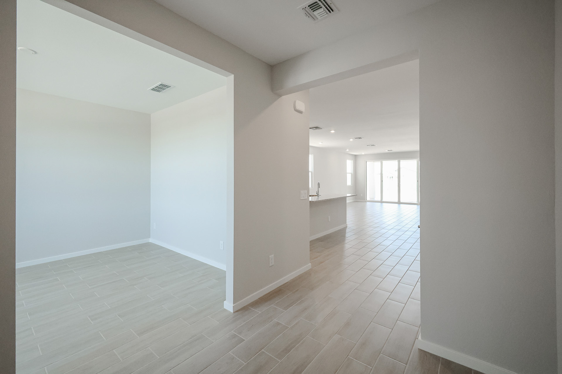 A long hallway with white walls.