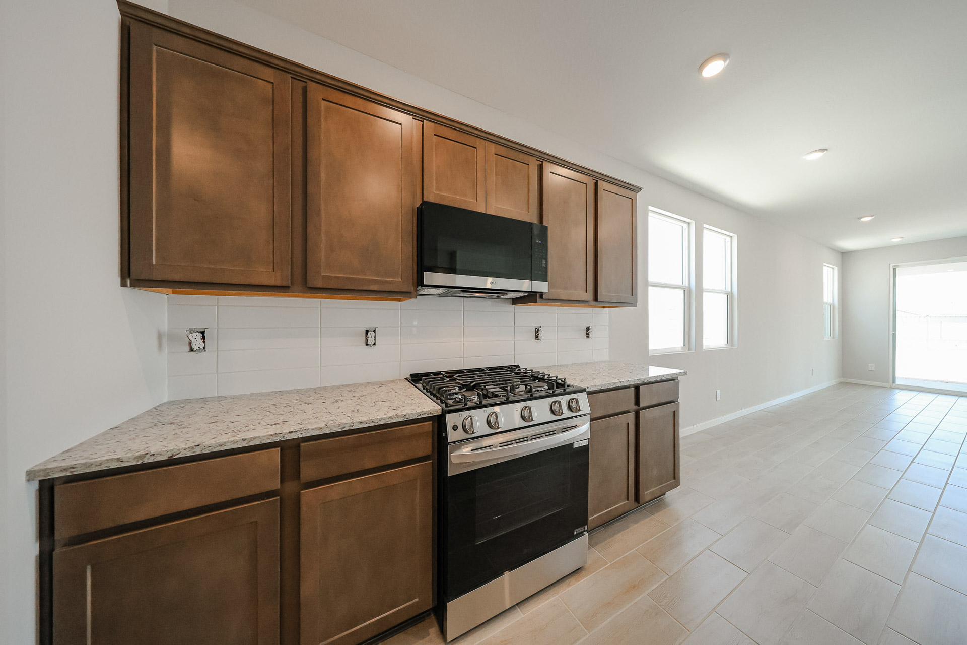 A kitchen with wooden cabinets.