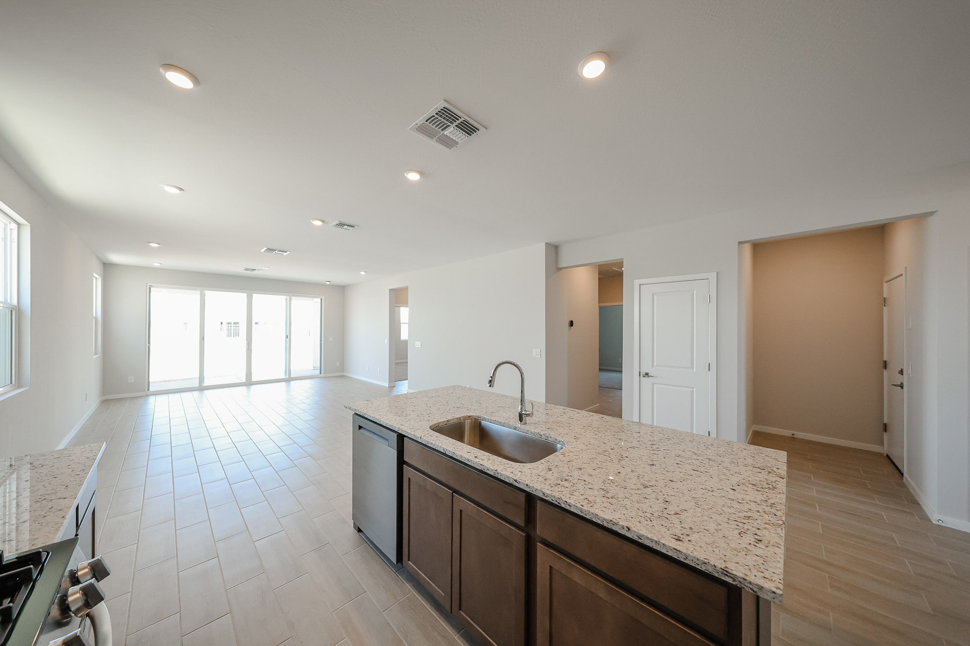 A kitchen with marble counters.