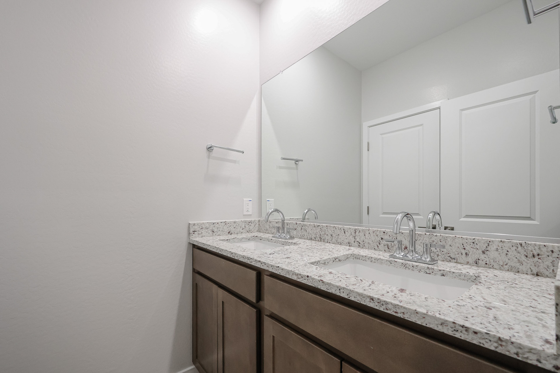 A bathroom with a marble countertop.