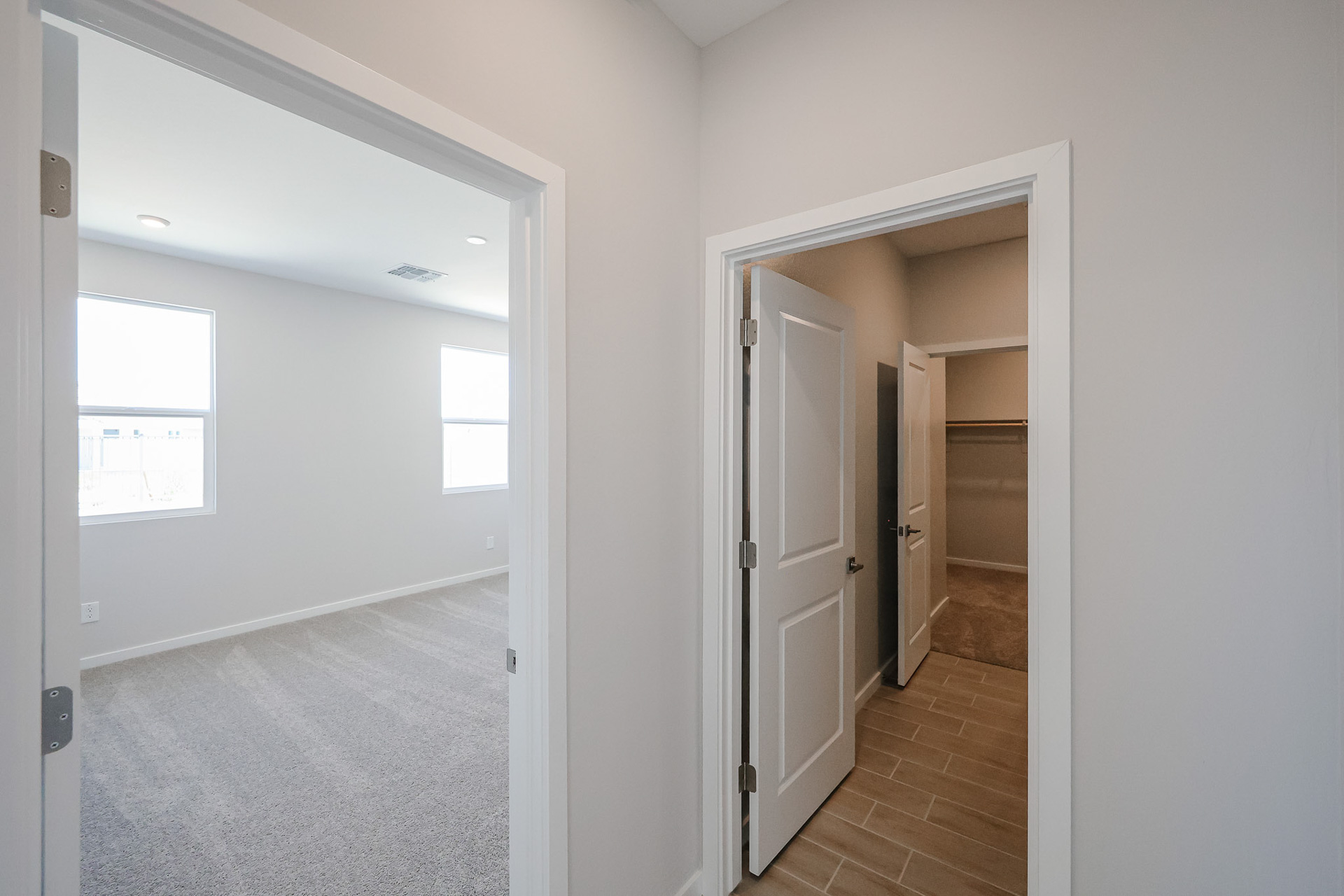 A hallway with white walls.