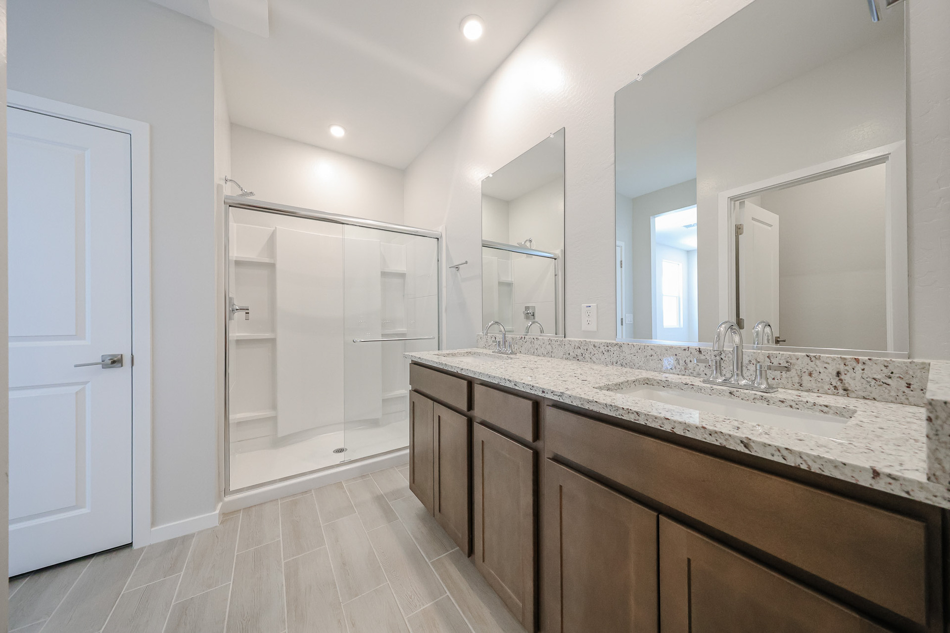 A bathroom with a marble countertop.