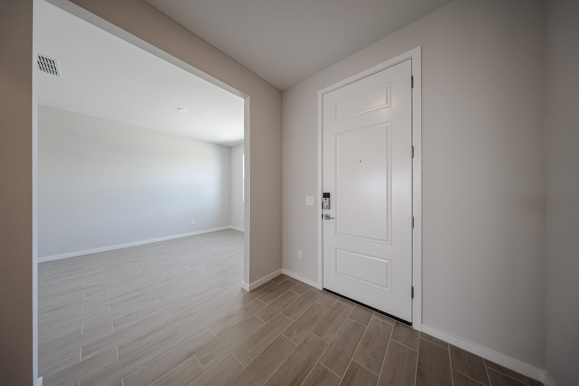 A hallway with white doors.