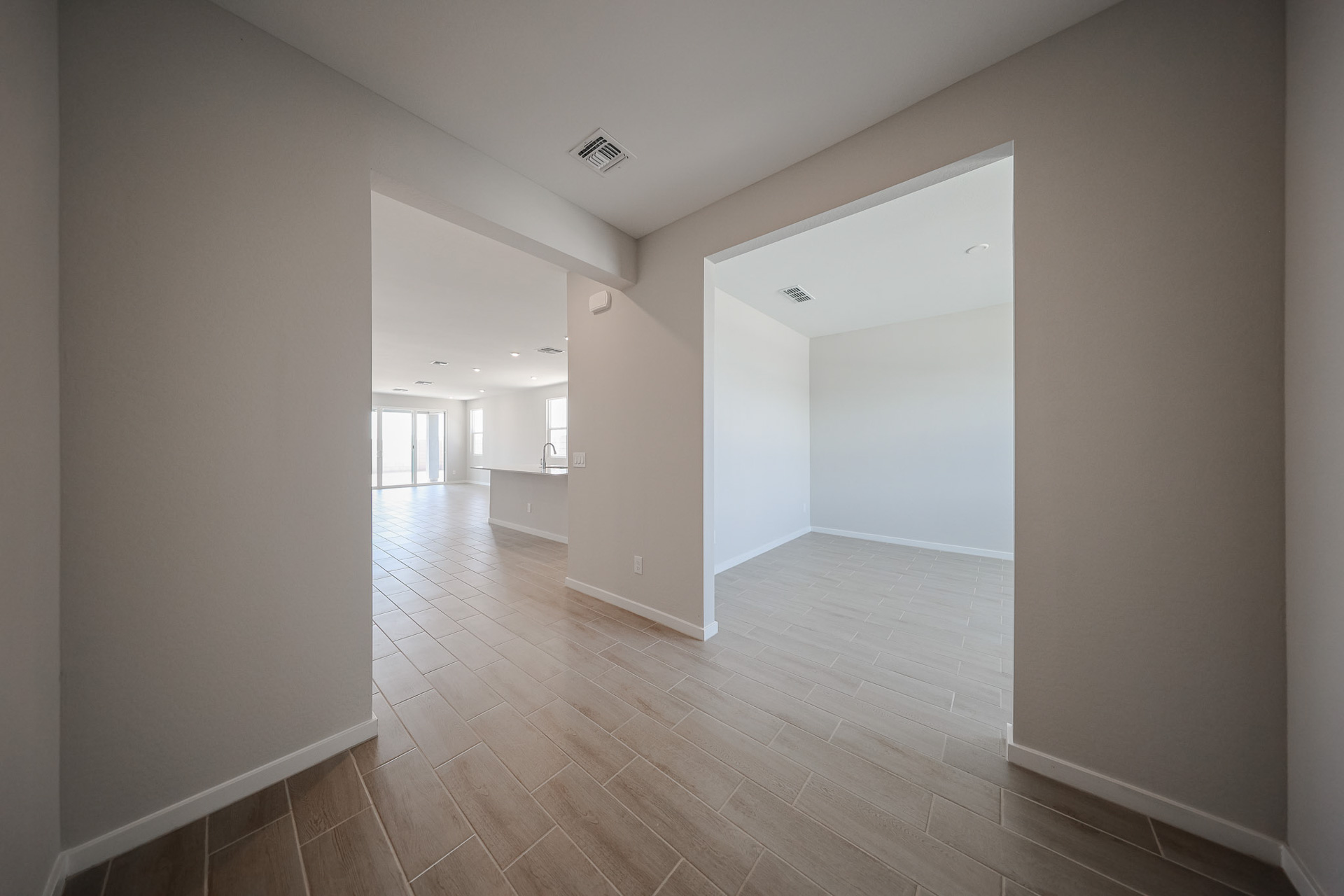 A long hallway with white walls.