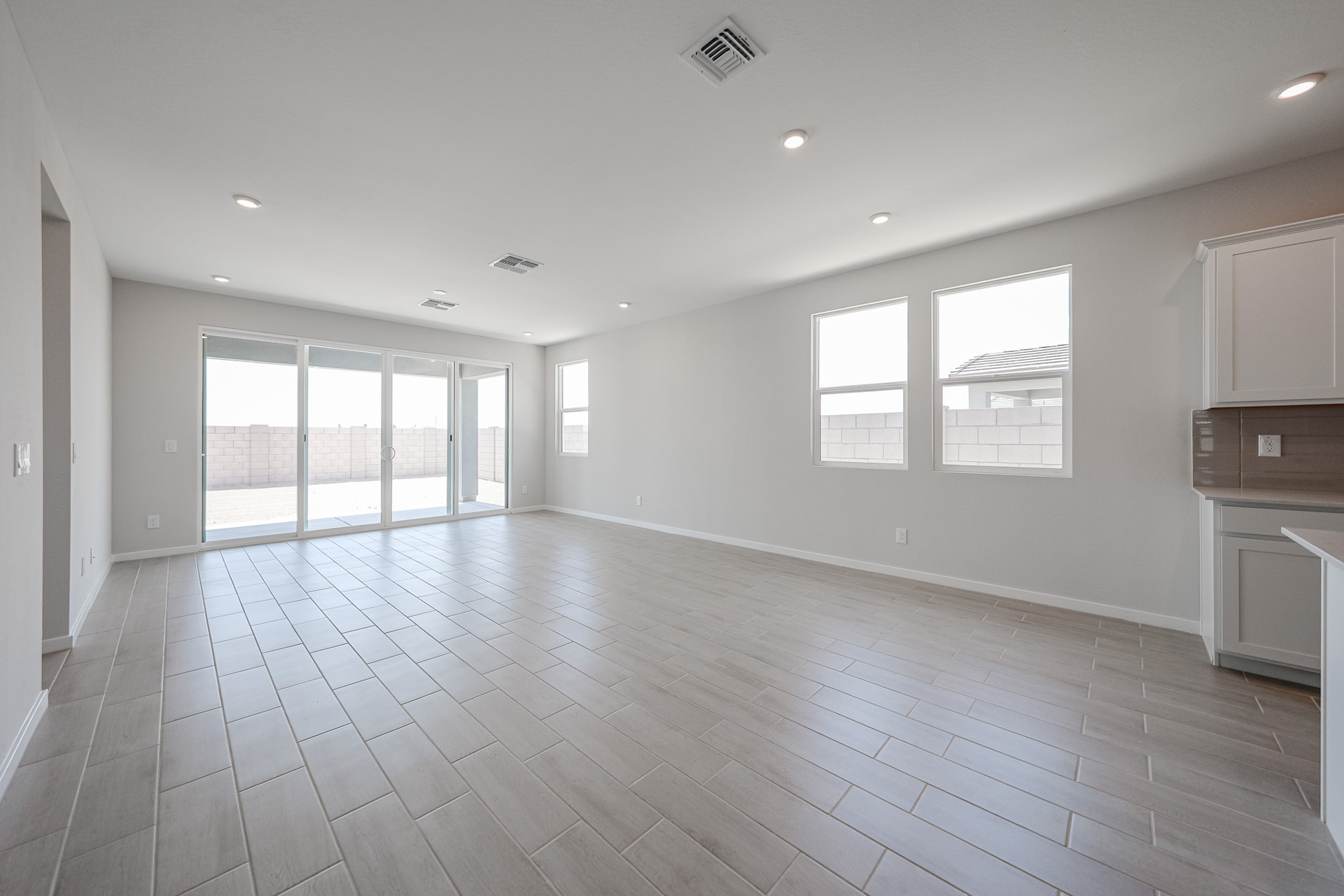 A large empty room with windows.
