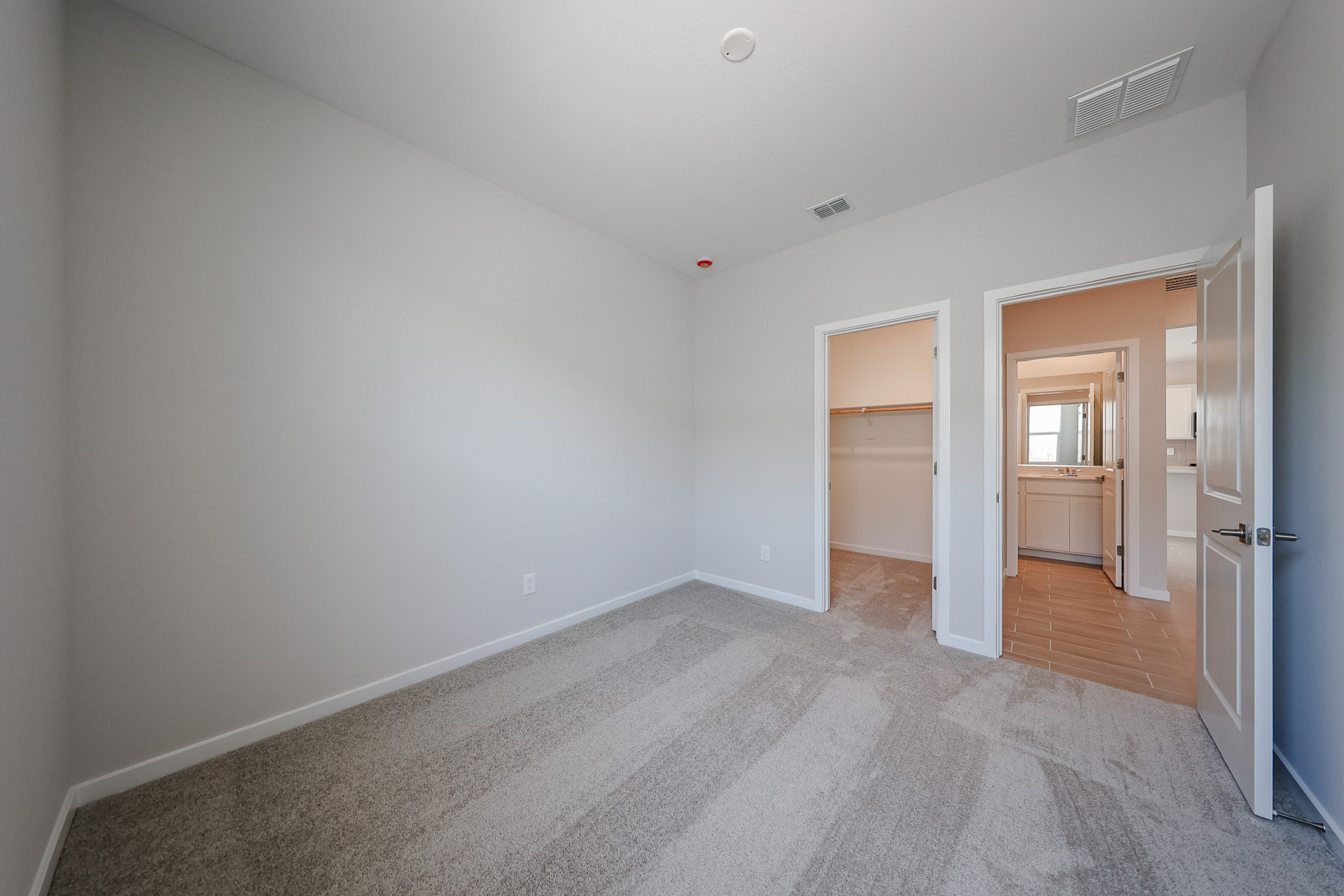 A hallway with white walls.