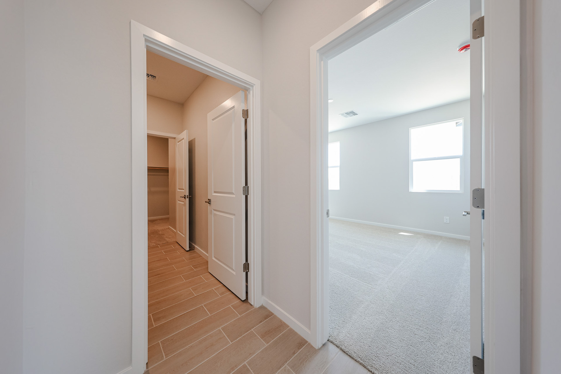 A hallway with white walls.