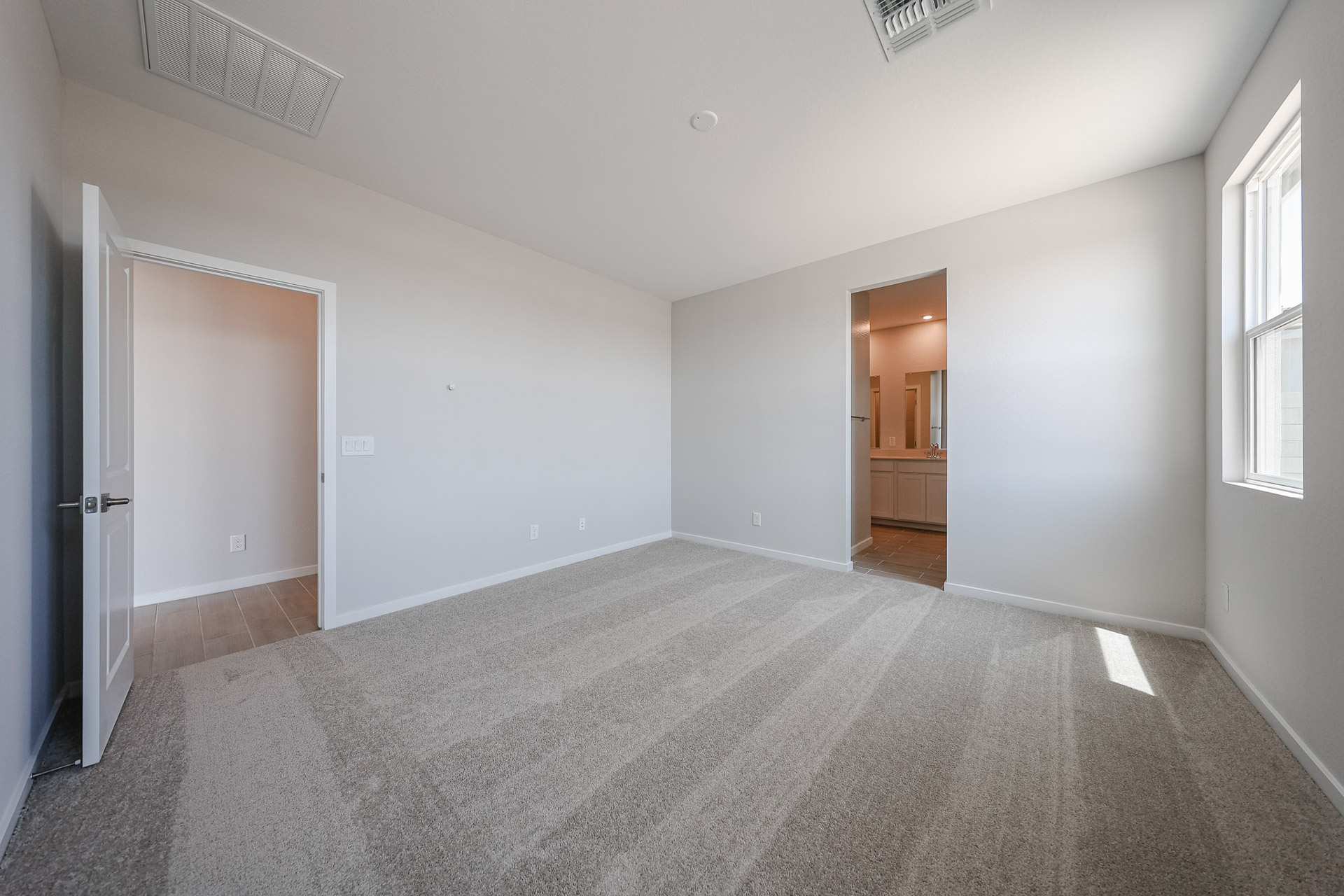 A hallway with white walls.