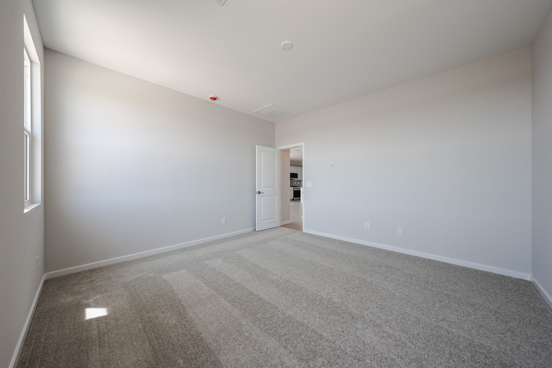 A hallway with white walls.
